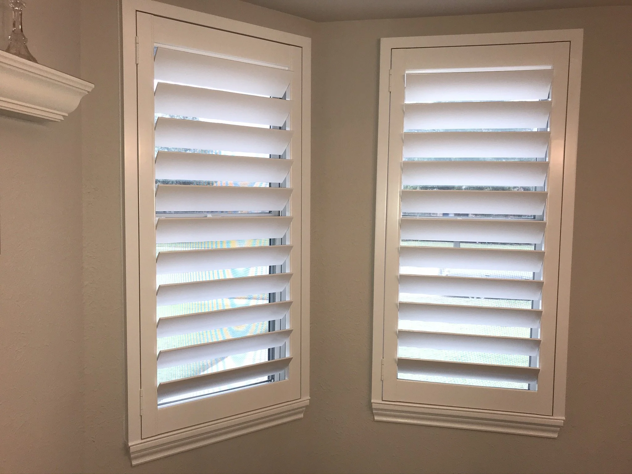 Custom wood plantation shutters with clearview (rear hidden tilt), 4 1/2" louvers, painted SW Pure White semi-gloss, 1.5" flat master frame and Z frame, no splits.  1 panel.