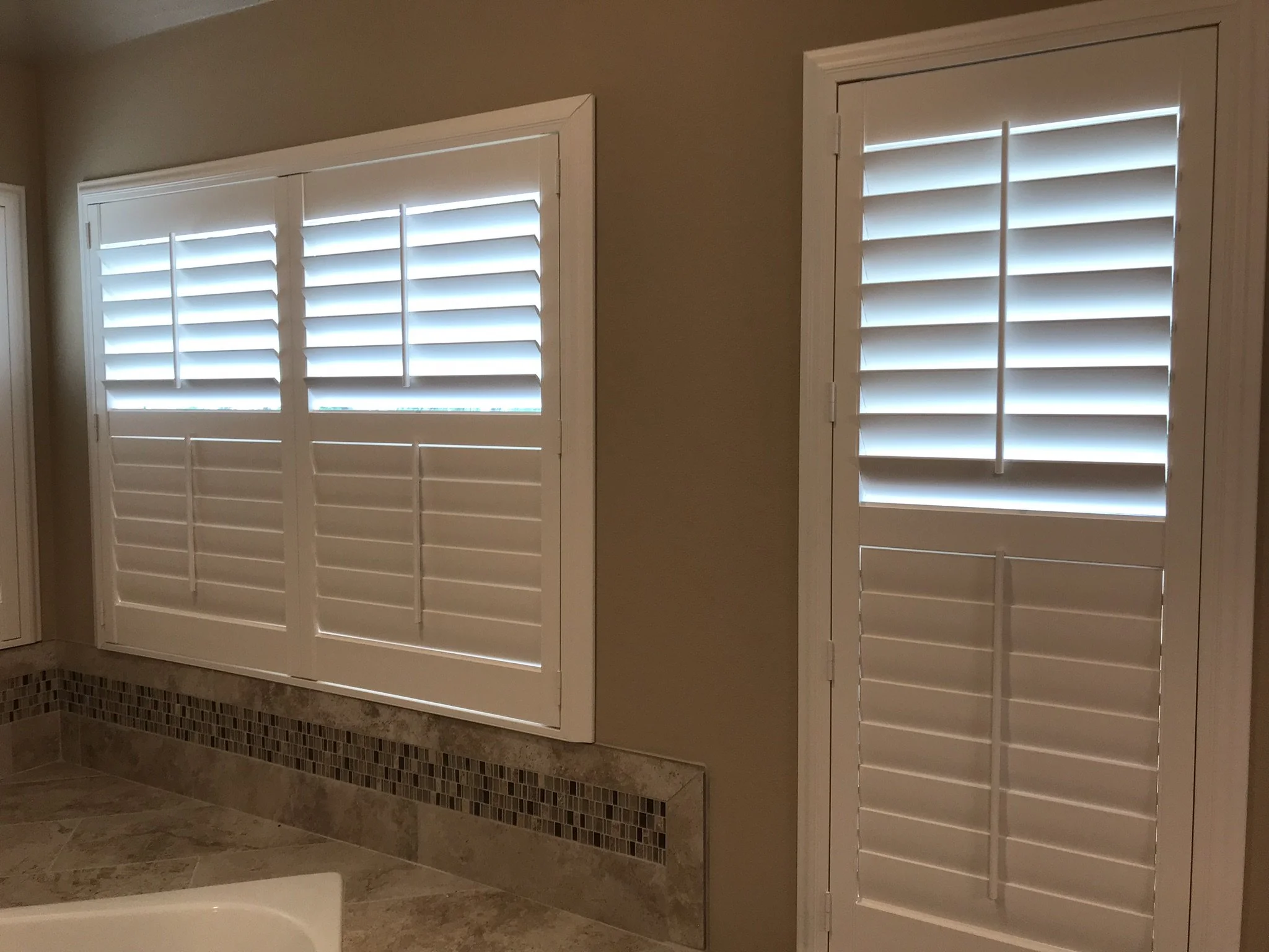 Hunter Douglas Palm Beach Polysatin Vinyl Shutters, 3 1/2" louvers, White Silk, divider rails, front tilt rods, Colonial Z frame, 1 panel and 2 panels, faux shutters.