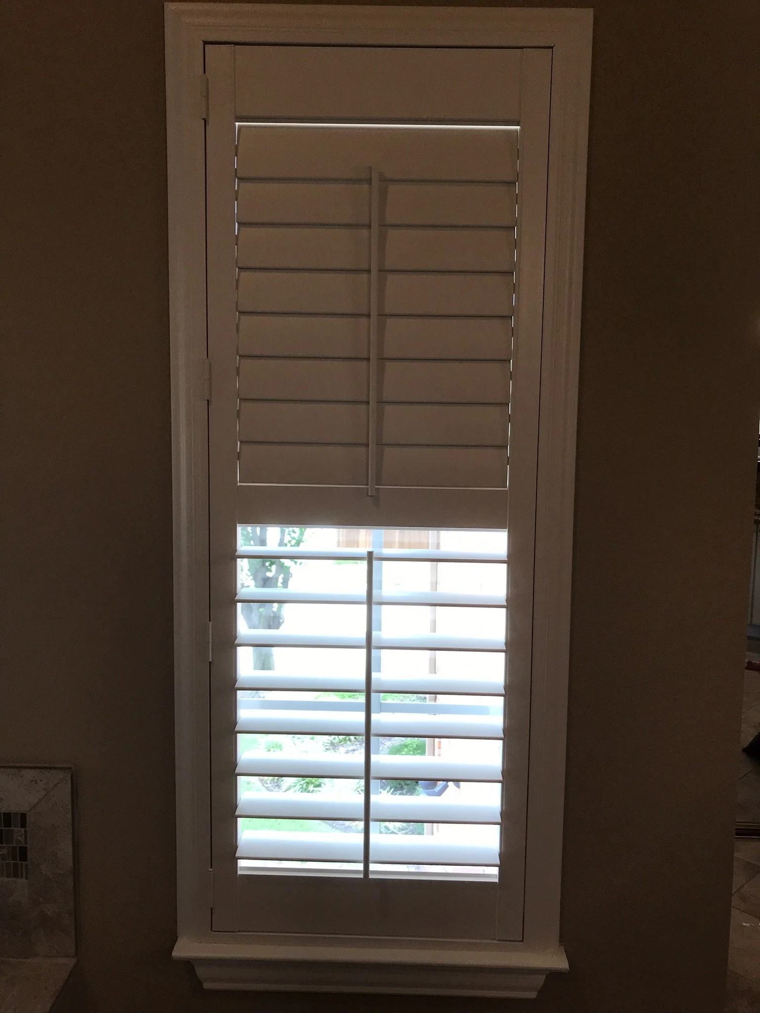 Hunter Douglas Palm Beach Polysatin Vinyl Shutters, 3 1/2" louvers, White Silk, divider rails, front tilt rods, Colonial Z frame, 1 panel and 2 panels, faux shutters.  Opened below cdr.