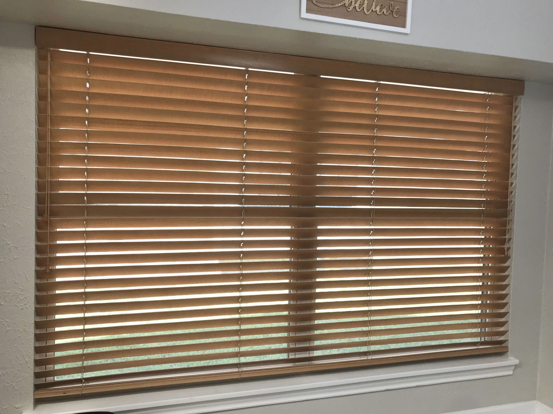 2" horizontal stained wood blinds.