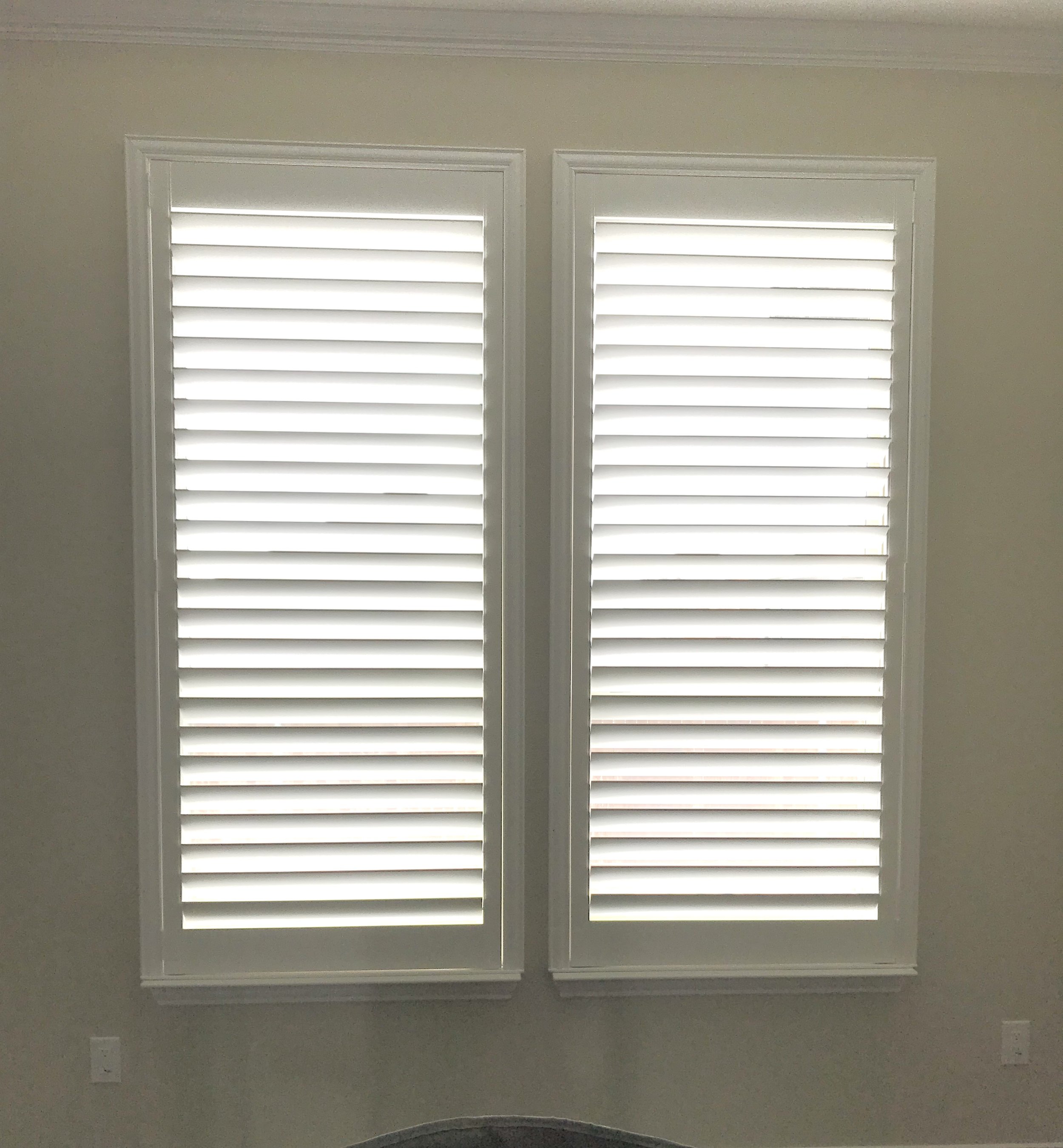 Custom wood shutters with Clearview (no tilt rods), Sherwin Williams Extra White, Belair master and z frame, 3 1/2" louvers, splits @ 50%, 1 panel.