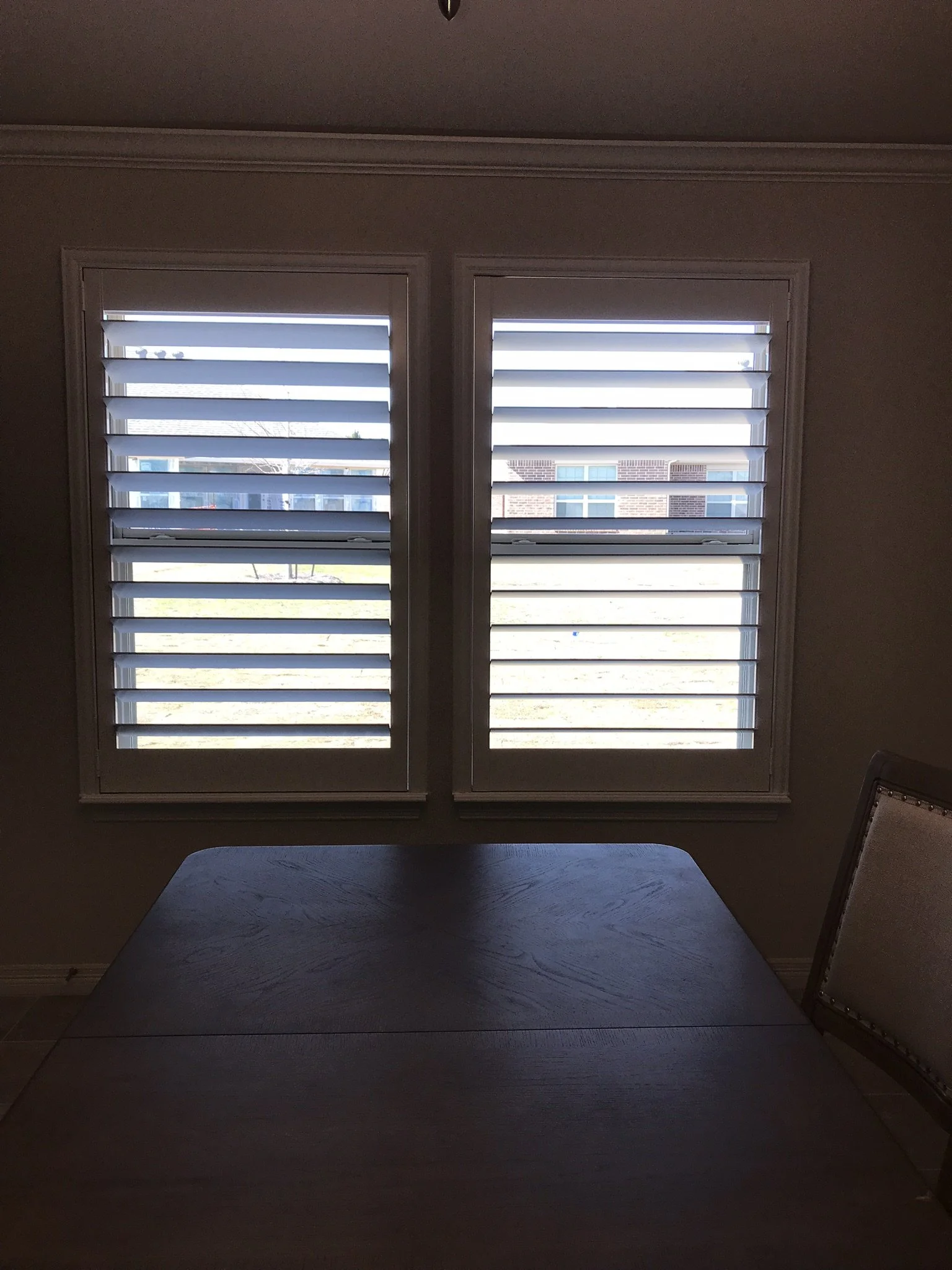 Custom wood shutter with rear tilt rod (clearview), painted white, splits at sash, no cdr.