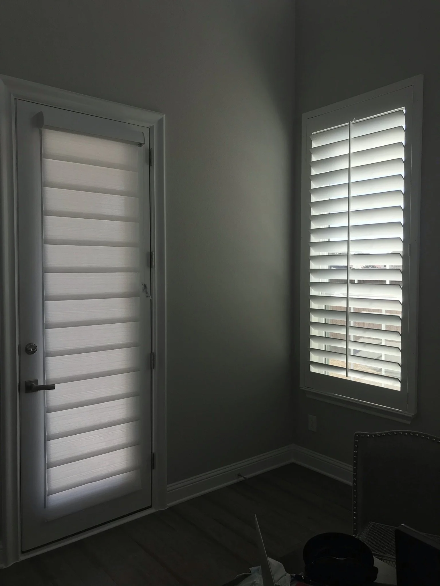 Custom wood shutters with front tilt rods, 4 1/2" louvers, painted, divider rail.