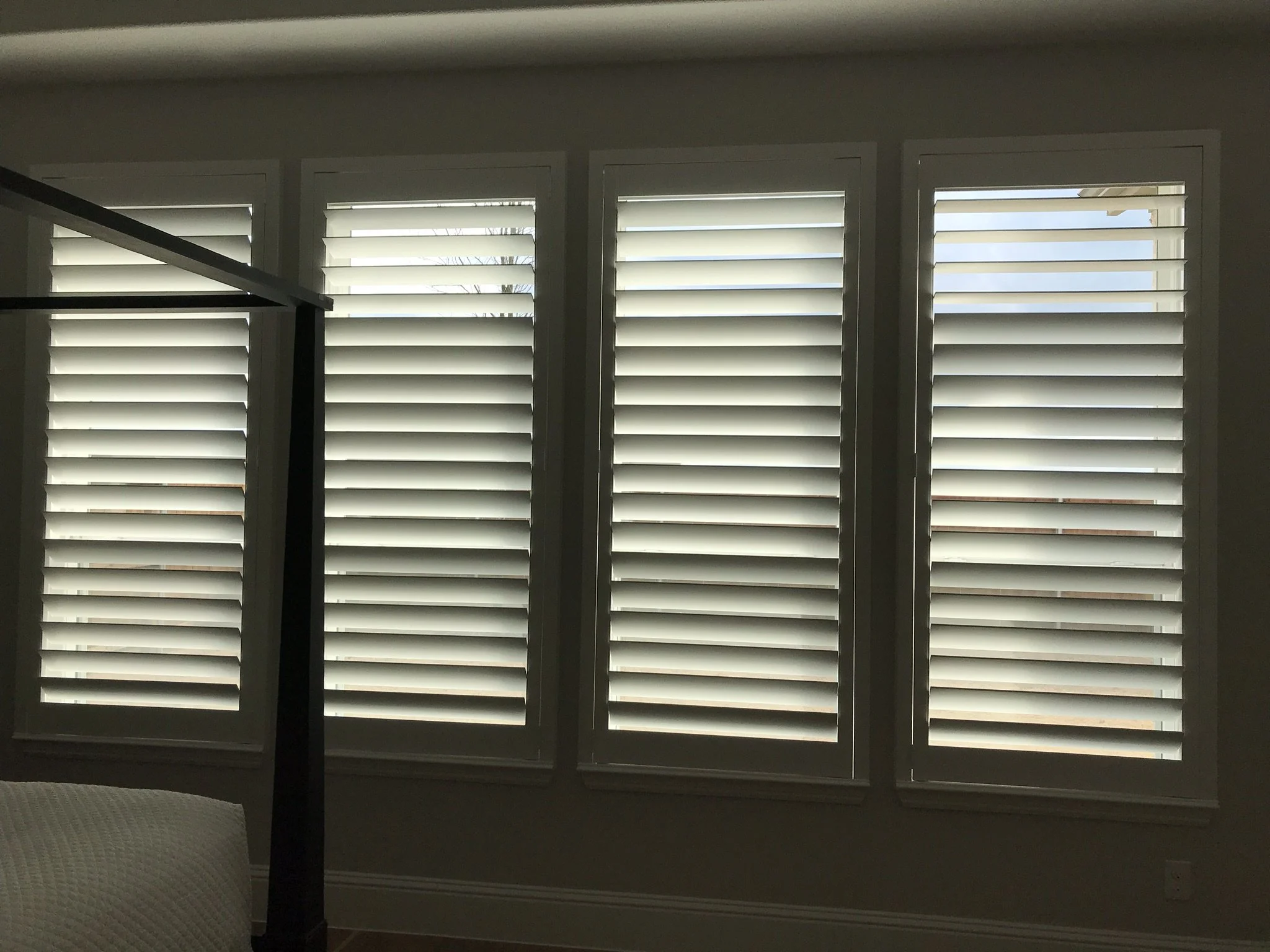 Wood shutters with Clearview (no tilt rod), 4.5" louvers, painted SW 7006 Extra White, flat master frame, split at top to leave 3 or 4 louvers, outside mount.
