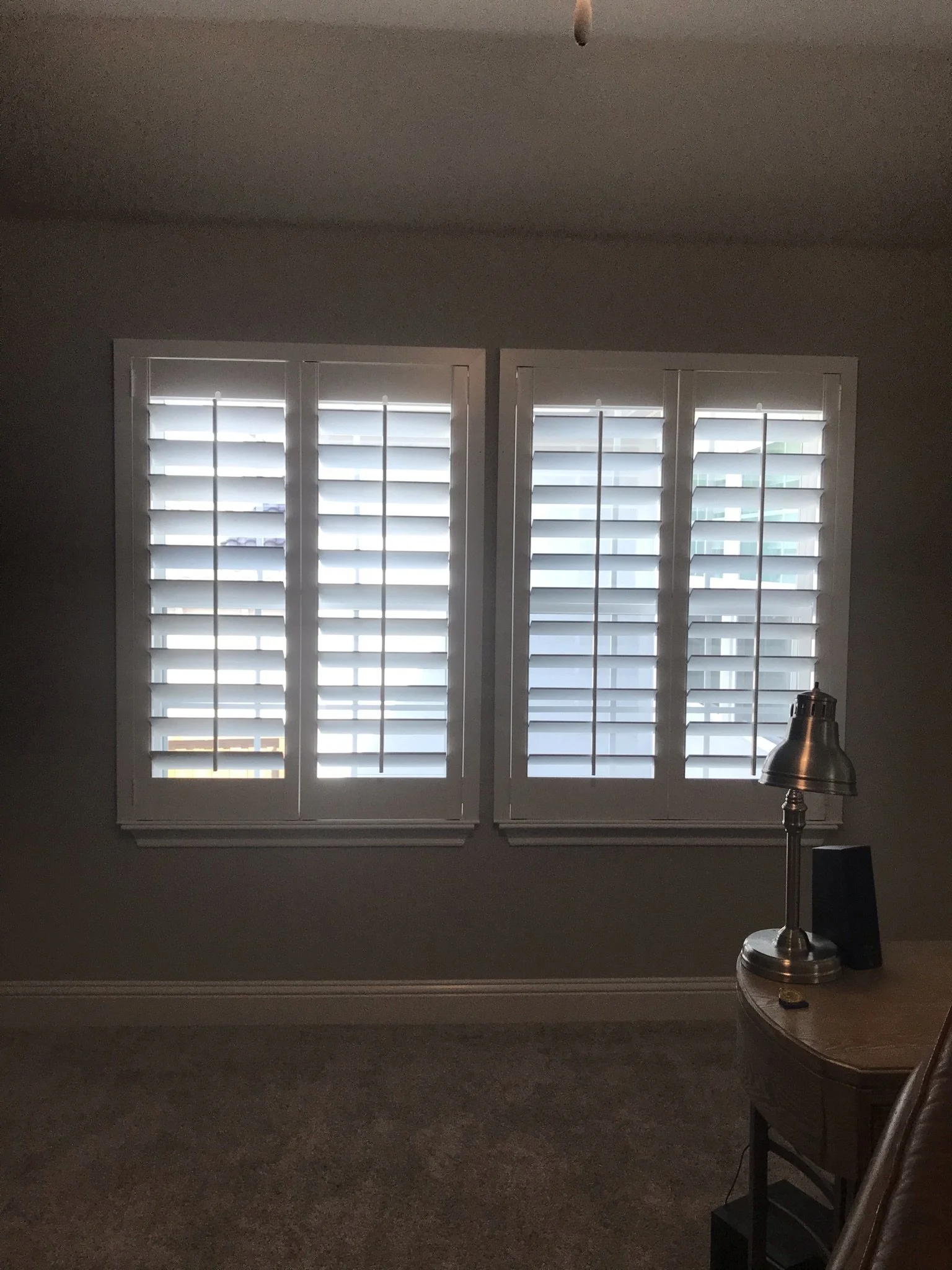 Custom wood shutters with front tilt rods, 4 1/2" louvers, painted, no divider rail.