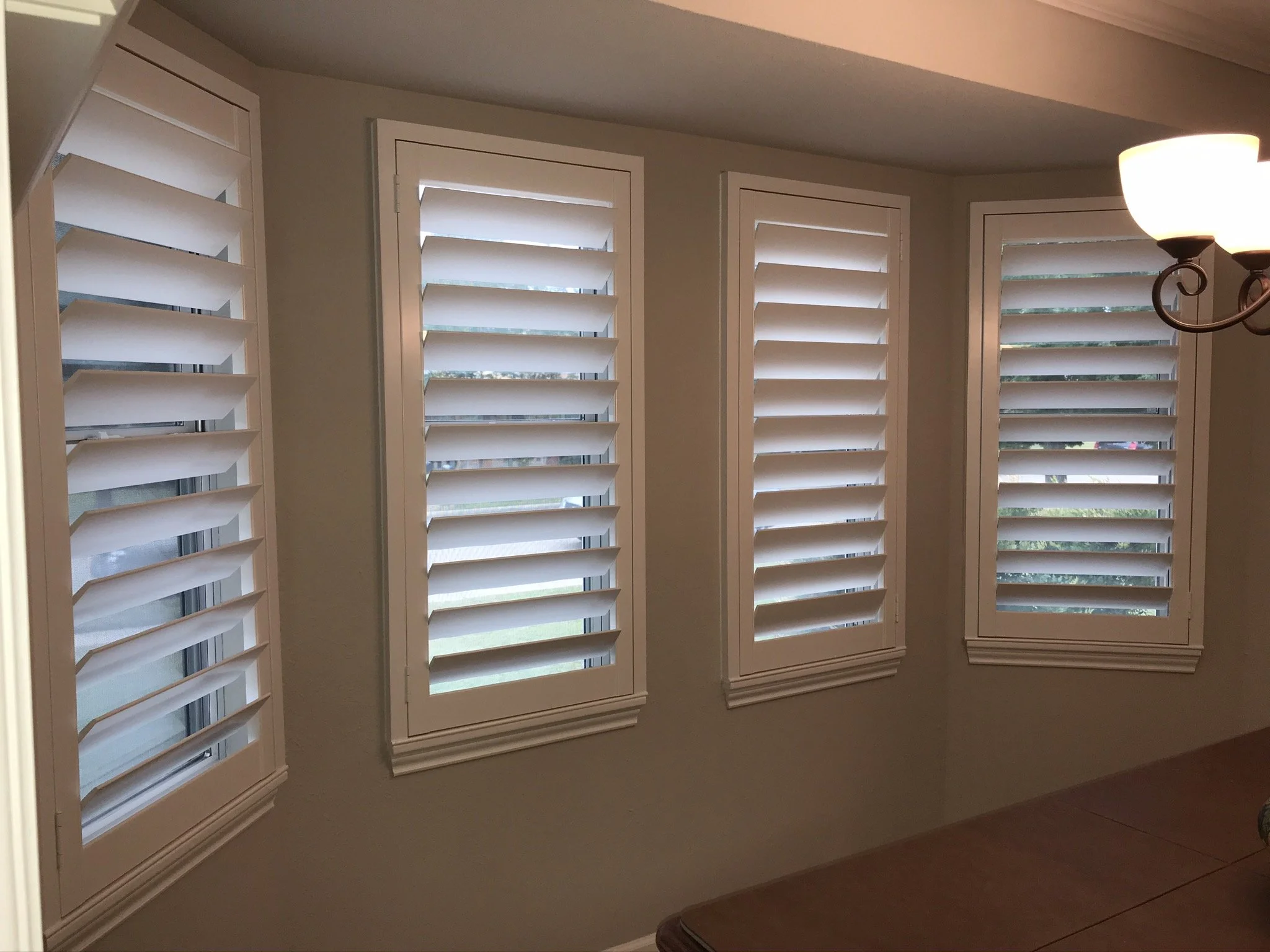 Custom wood plantation shutters with clearview (rear hidden tilt), 4 1/2" louvers, painted SW Pure White semi-gloss, 1.5" flat master frame and Z frame, no splits.  1 panel.