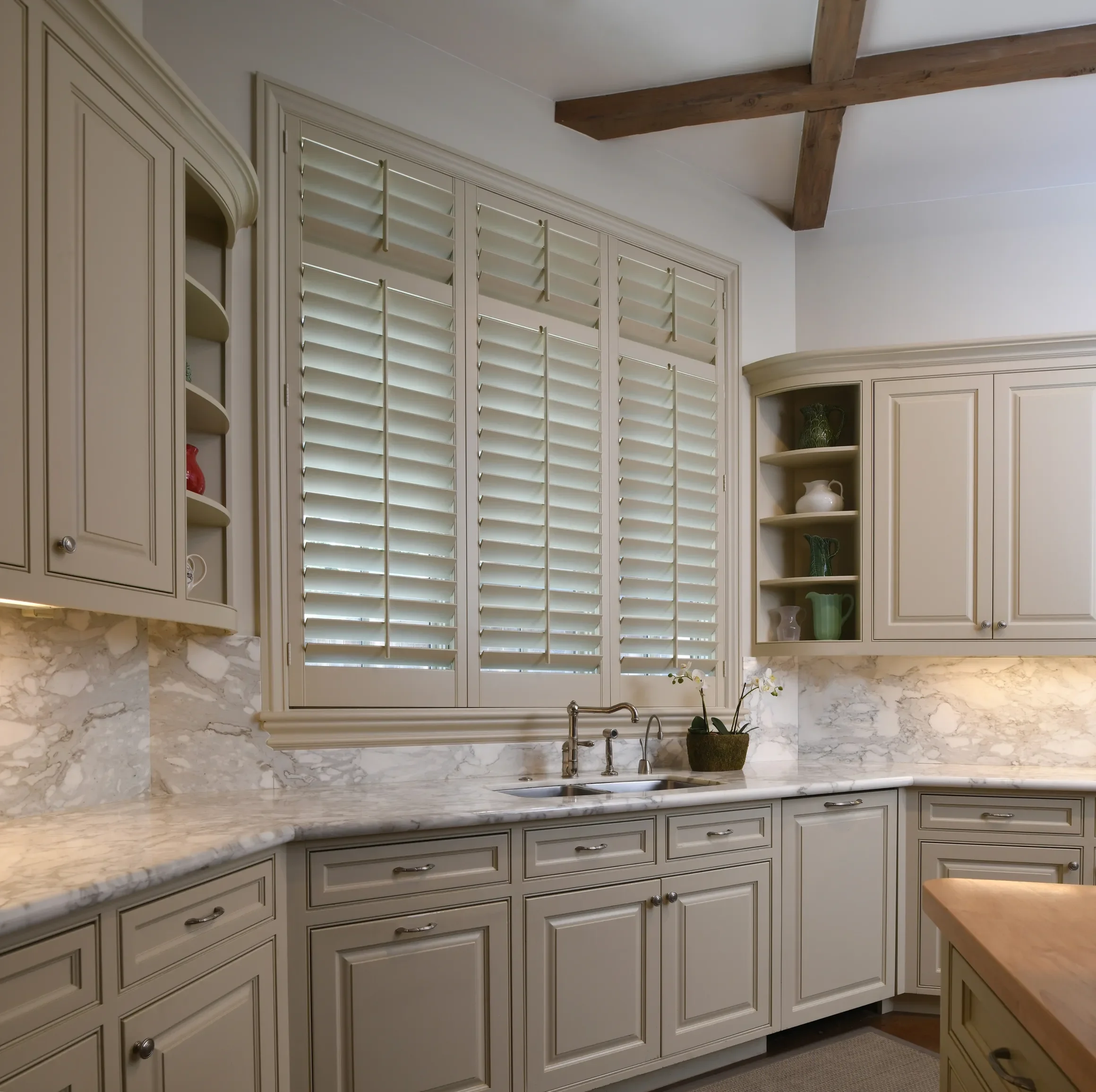 Custom wood shutters, painted to match wood trim, 3 1/2" louvers, front tilt rod, 2 t-posts, divider rails.