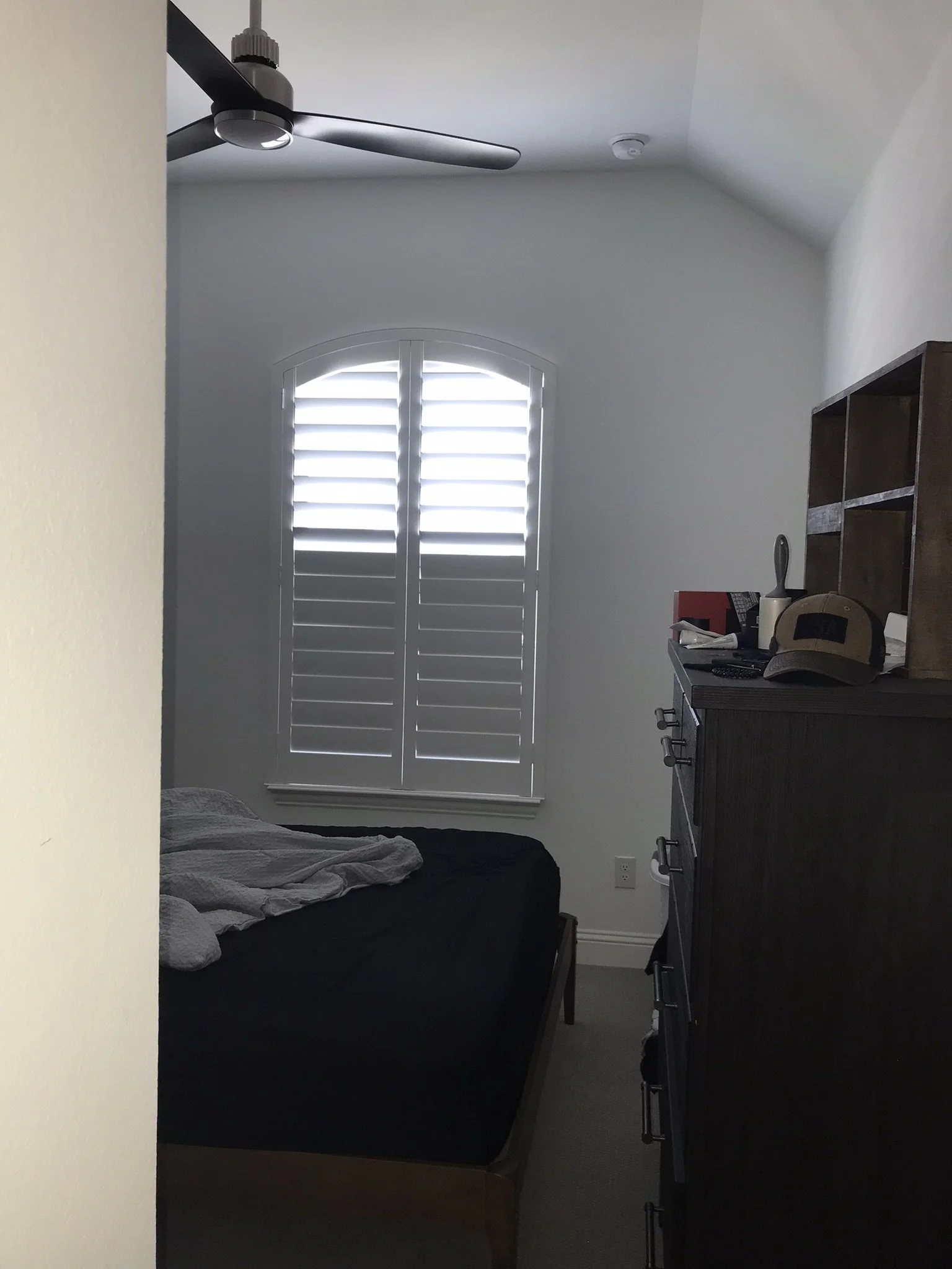 Custom wood shutter, eyebrow arch top, 4 1/2" louvers, painted white, 2 panels, no divider rails.