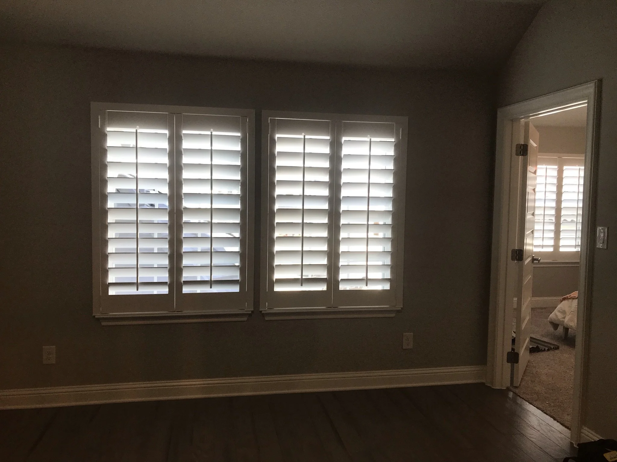 Custom wood shutters with front tilt rods, 4 1/2" louvers, painted, no divider rail.