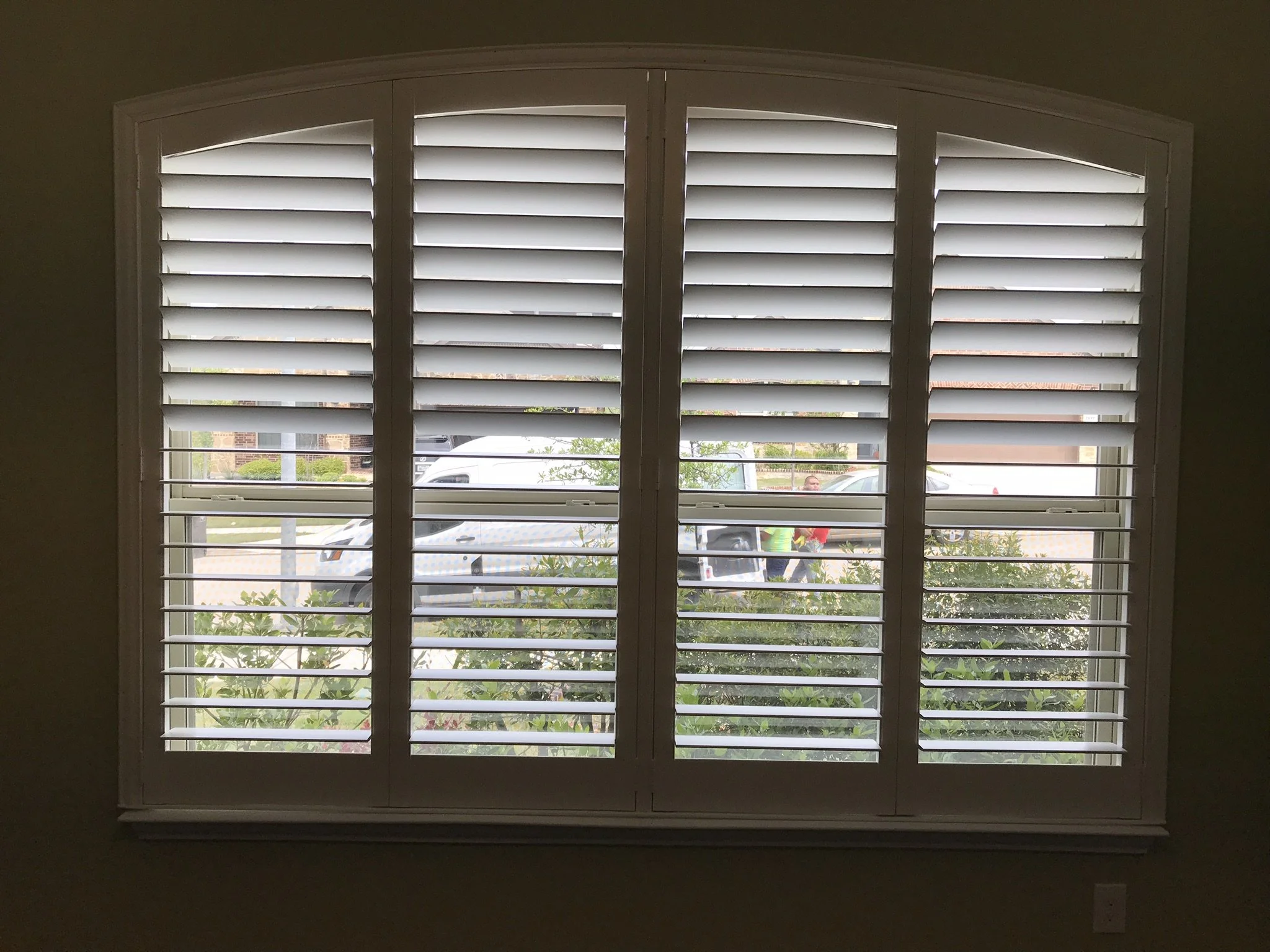 Custom wood shutters with Clearview (no tilt rods), Sherwin Williams Extra White, Belair master and z frame, 3 1/2" louvers, splits @ 50%, 4 panel eyebrow arch.