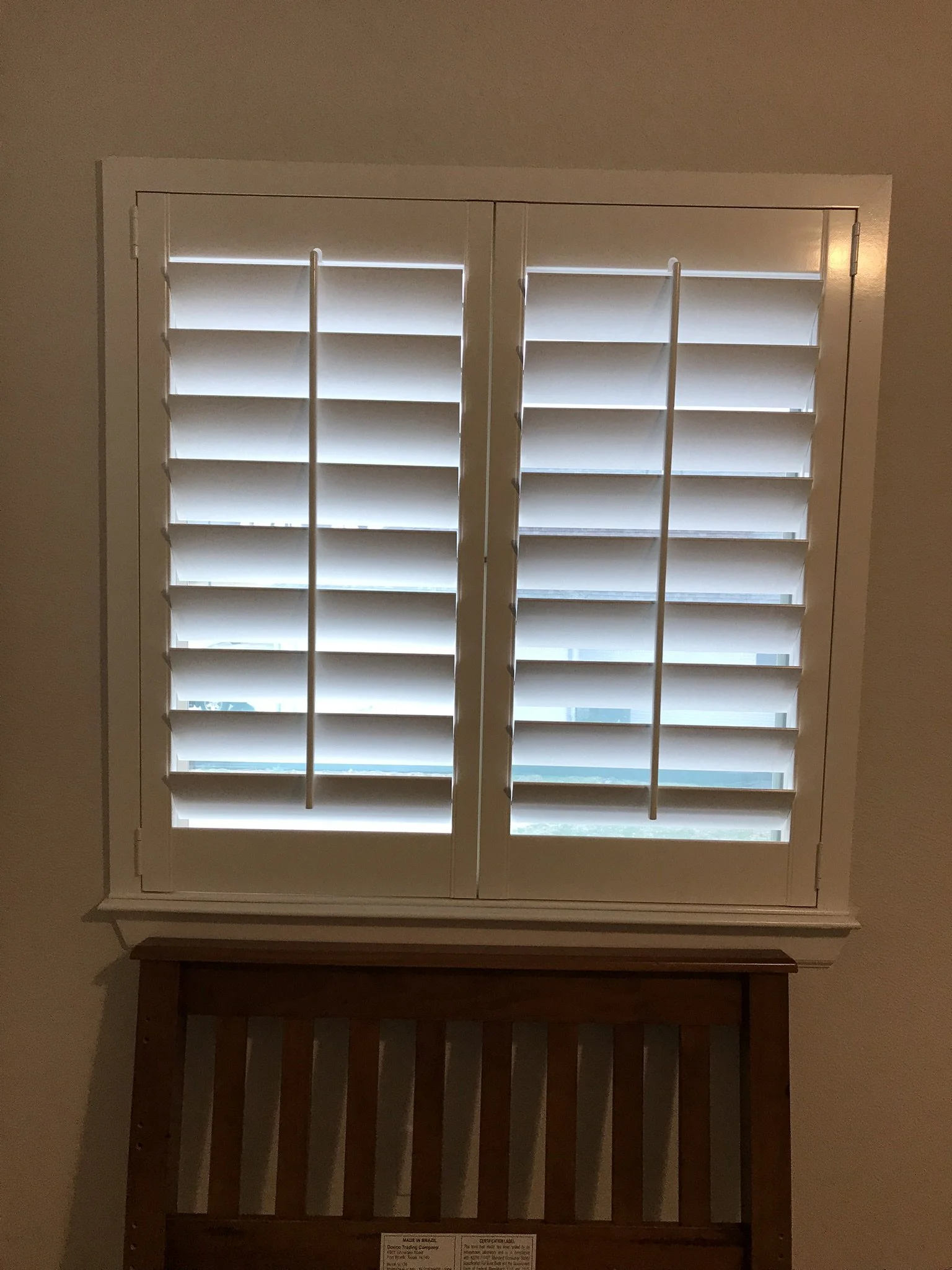Wood Shutters with tilt rods, painted white, flat master frame, no divider rails, 2 panels.