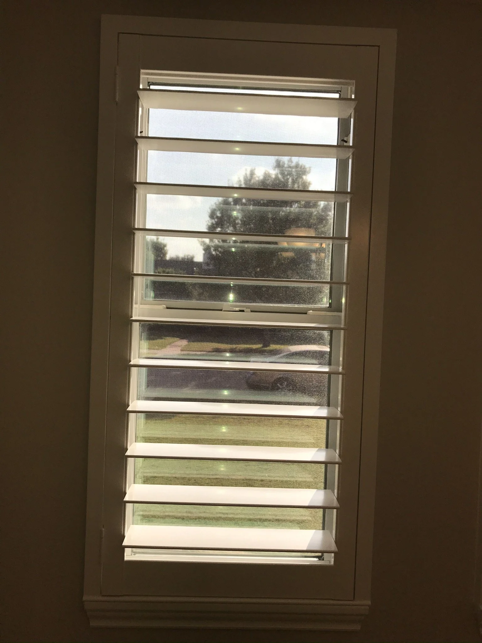 Custom wood plantation shutters with clearview (rear hidden tilt), 4 1/2" louvers, painted SW Pure White semi-gloss, 1.5" flat master frame and Z frame, no splits.  1 panel.