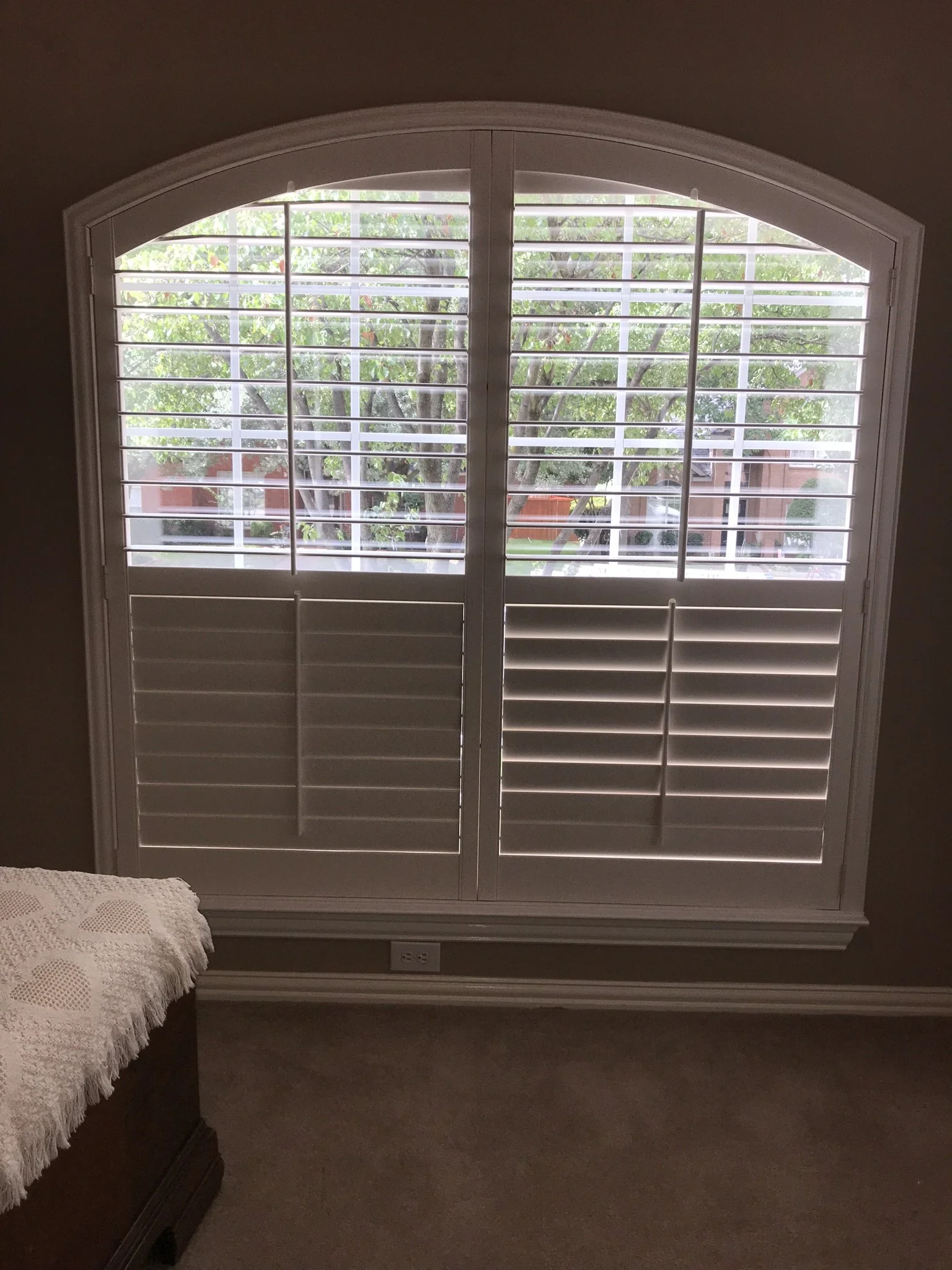 Custom Wood Plantation Shutters, 3 1/2" louvers, painted Sherwin Williams match to Behr Swiss Coffee, divider rails at sash, front tilt rod, Belair Z frame, 2 panels hinged left and right, eyebrow arch top.