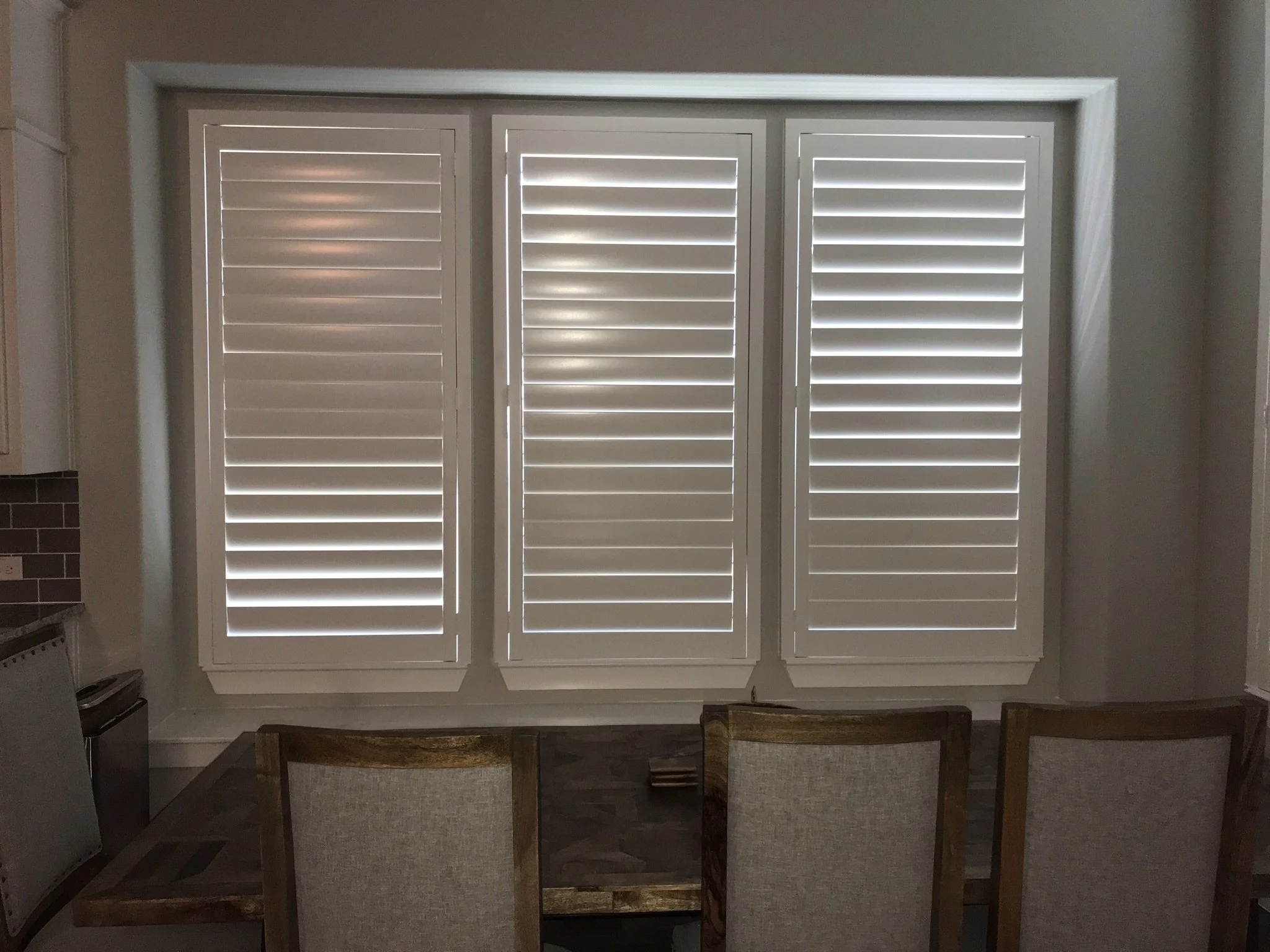 Wood shutters with rear hidden tilt, 4 1/2" louvers, SW Pure White, no divider rails.  