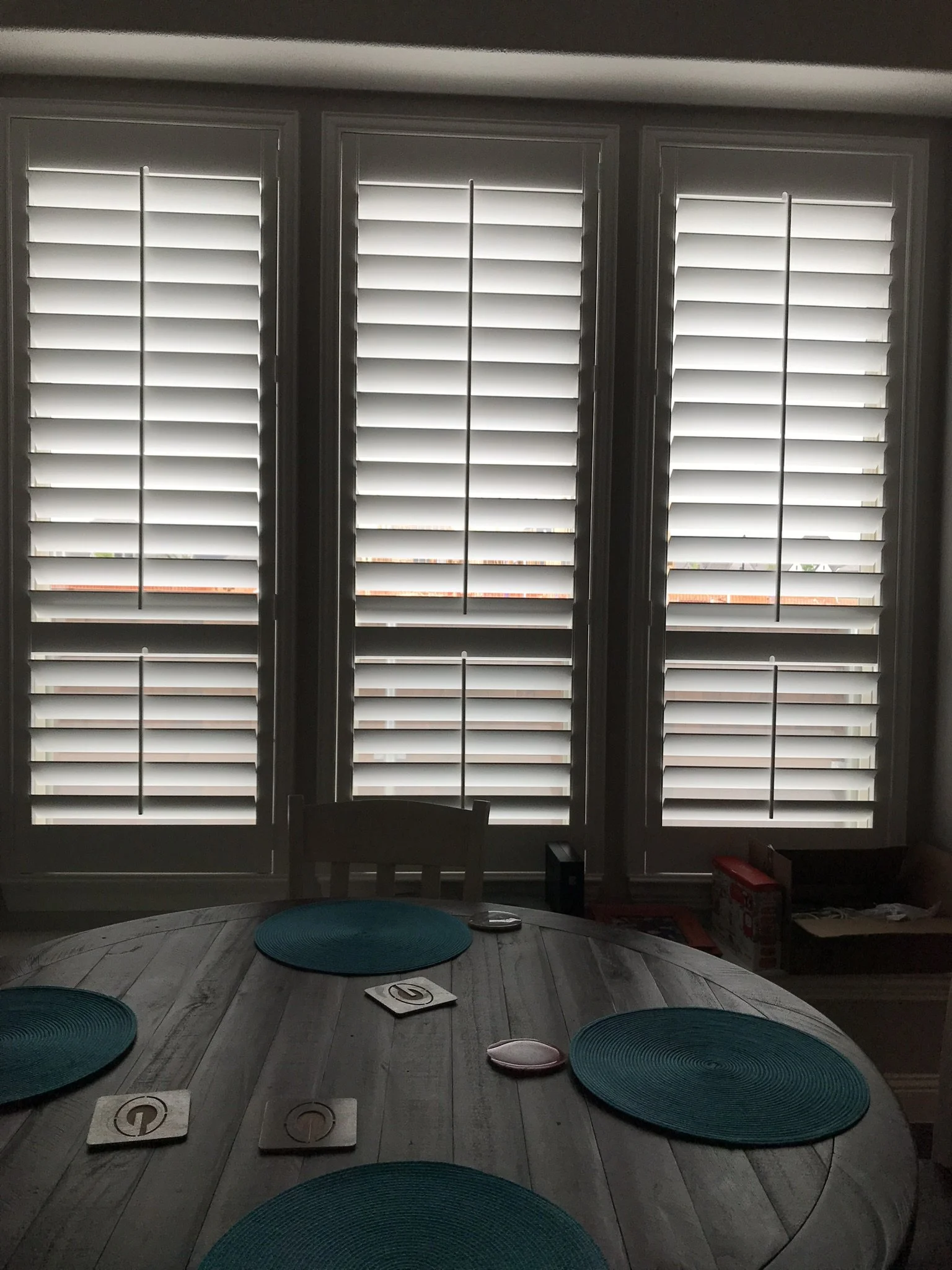 4 1/2" louvers, wood shutters with tilt rods, divider rails at sash, painted.