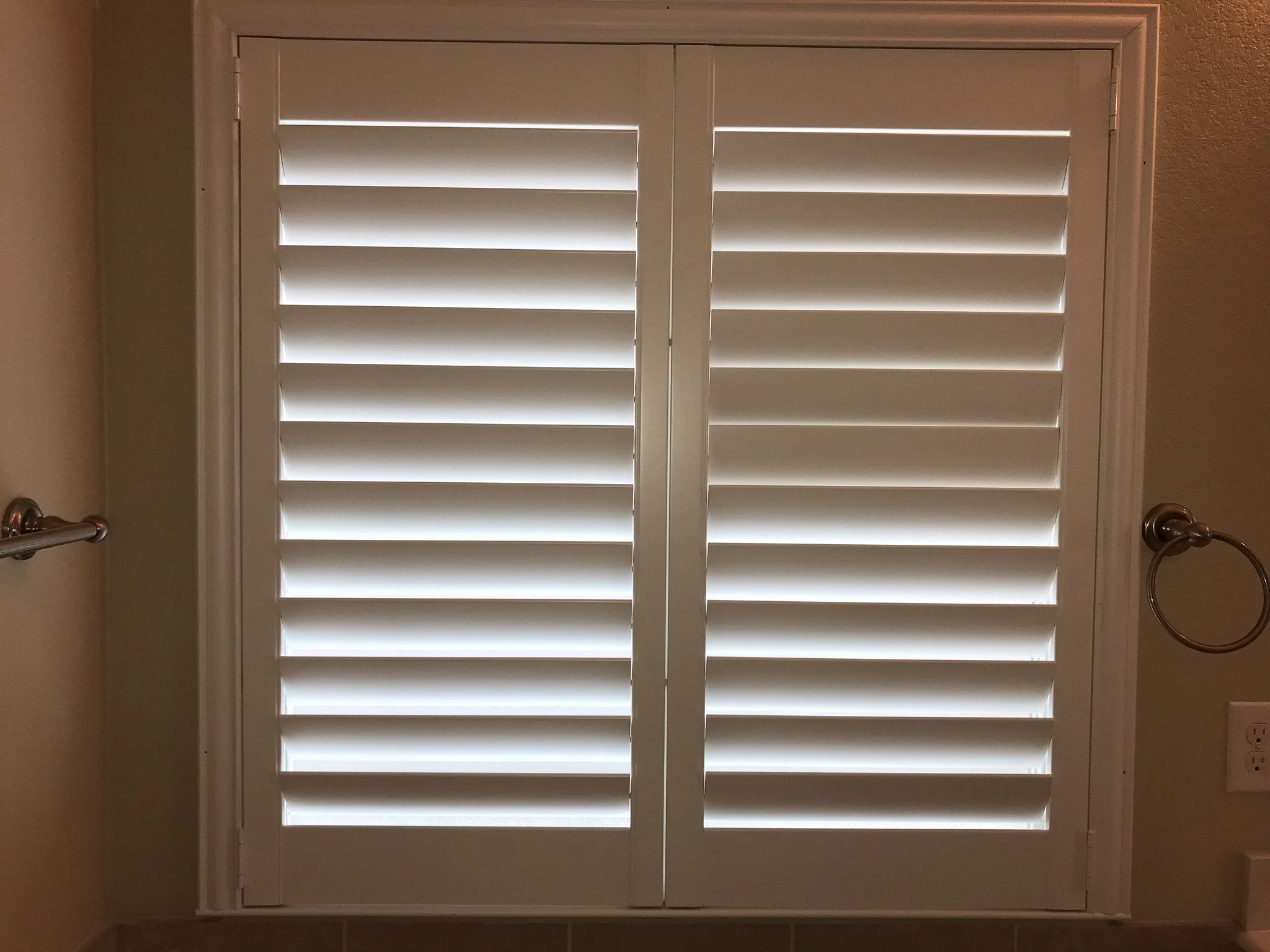 Custom wood shutters with Clearview (no tilt rods), Sherwin Williams Extra White, Belair master and z frame, 3 1/2" louvers, splits @ 50%, 2 panels.
