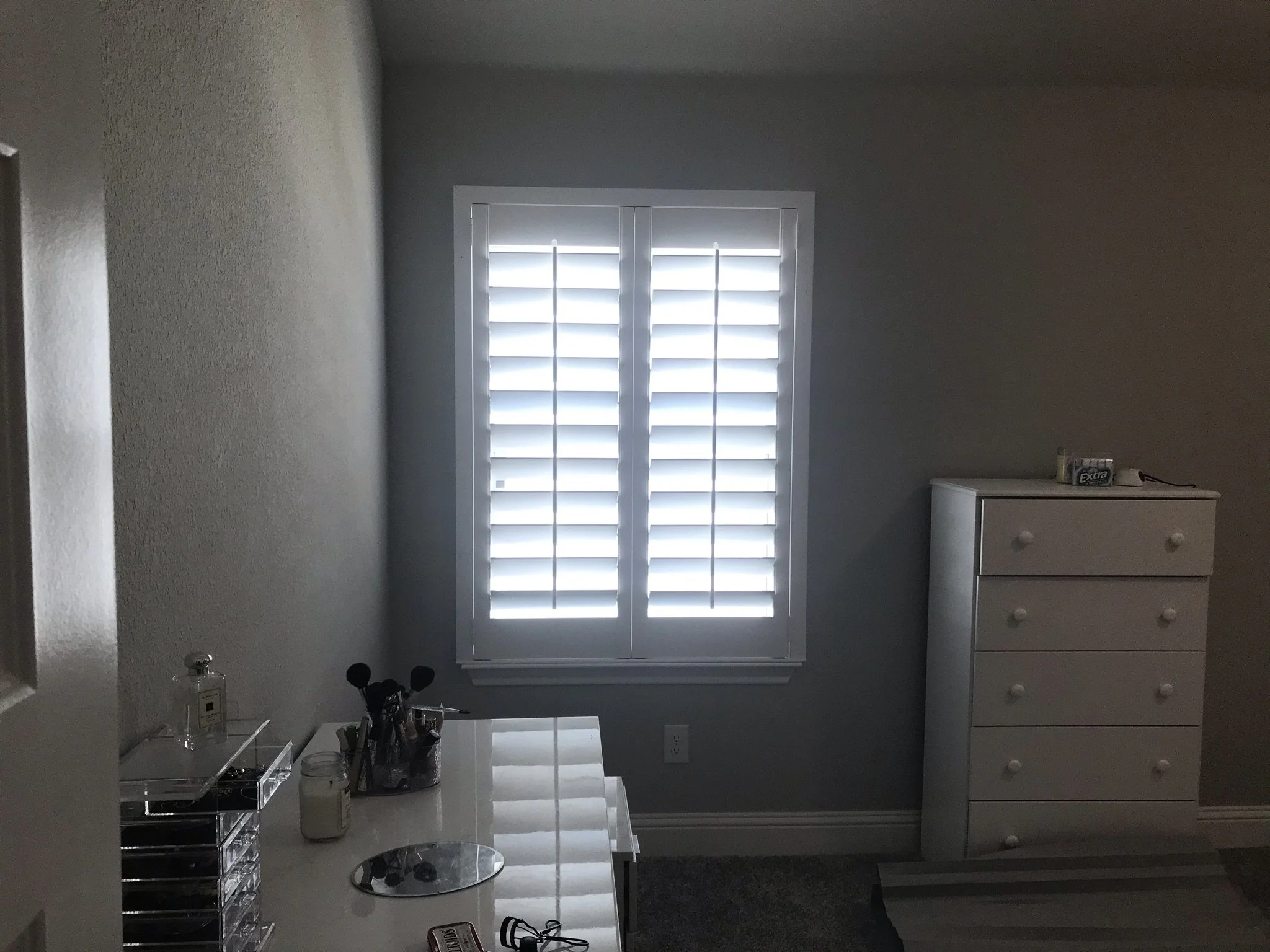 Custom wood shutters with front tilt rods, 4 1/2" louvers, painted, no divider rail.