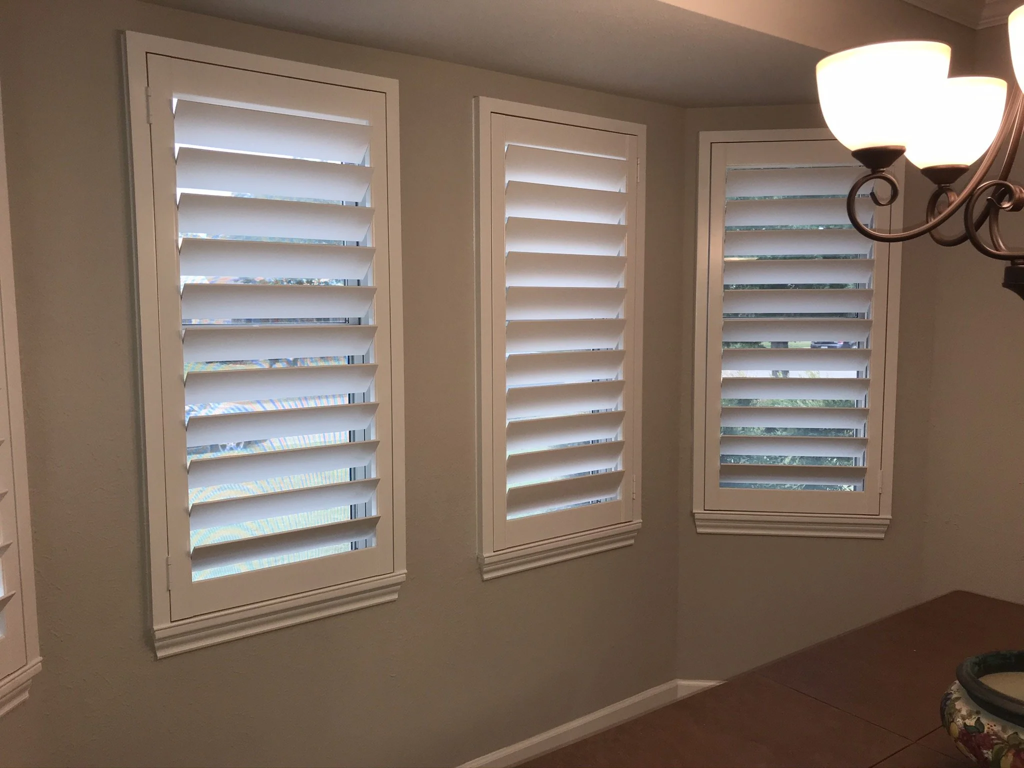 Custom wood plantation shutters with clearview (rear hidden tilt), 4 1/2" louvers, painted SW Pure White semi-gloss, 1.5" flat master frame and Z frame, no splits.  1 panel.