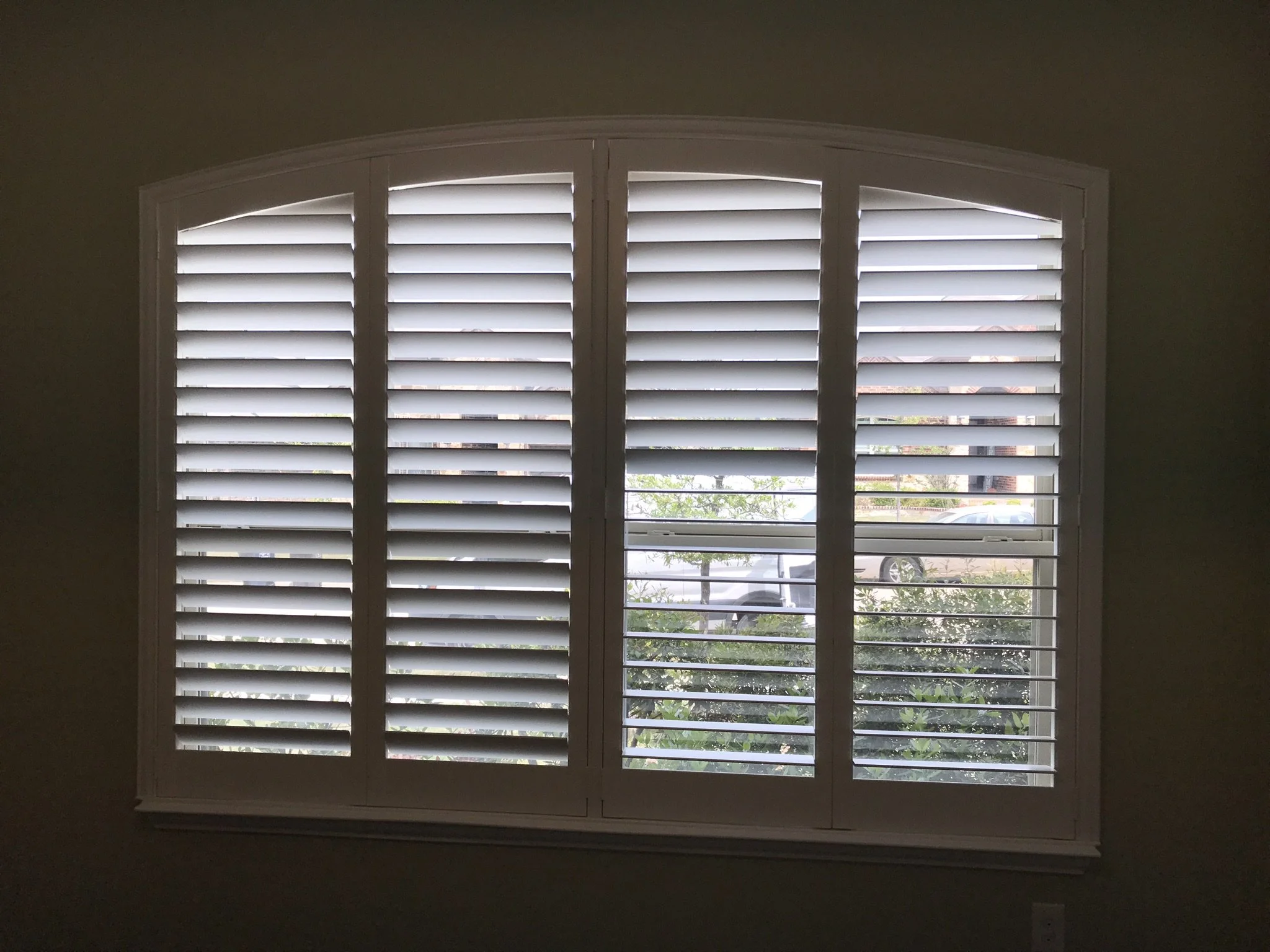 Custom wood shutters with Clearview (no tilt rods), Sherwin Williams Extra White, Belair master and z frame, 3 1/2" louvers, splits @ 50%, 4 panel eyebrow arch.
