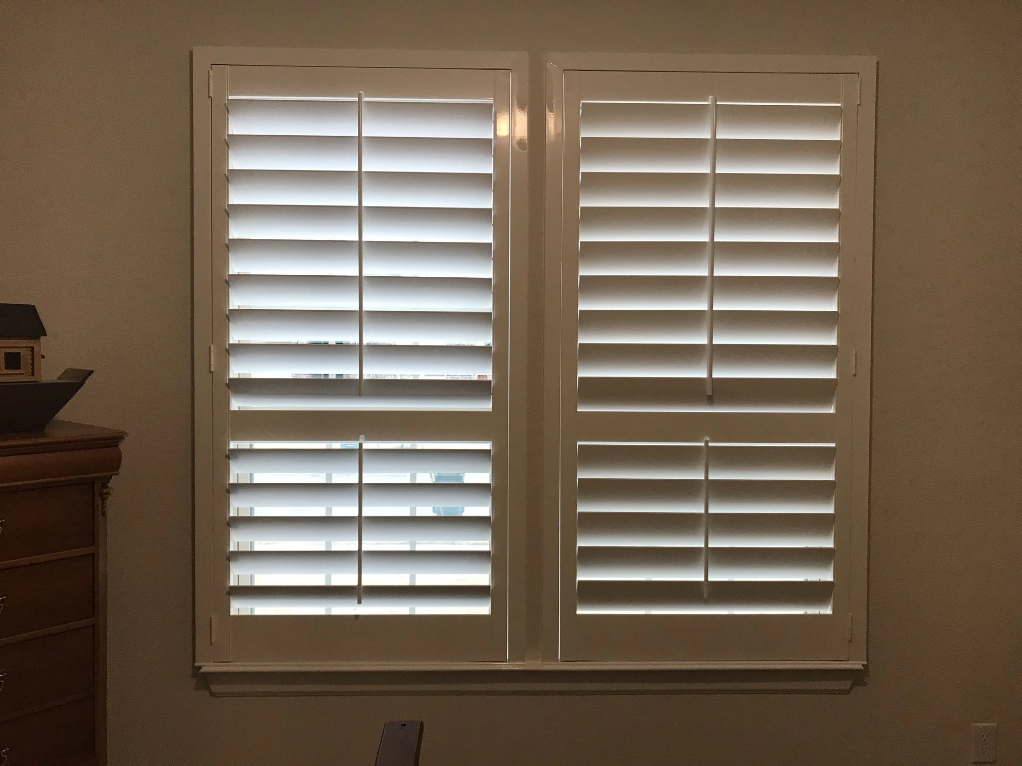 Wood Shutters with tilt rods, painted white, flat master frame, divider rails, 1 panel.