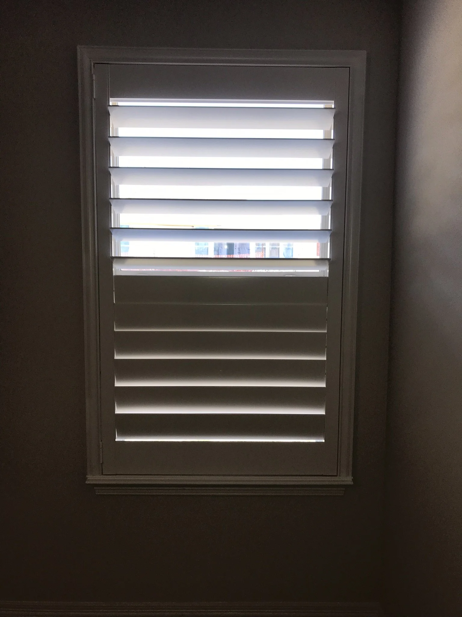 Custom wood shutter with rear tilt rod (clearview), painted white, splits at sash, no cdr.