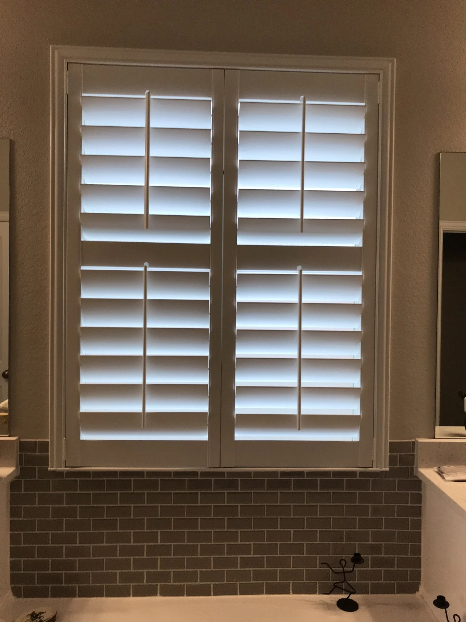 Wood shutters with front tilt rods, 4 1/2" louvers, divider rails, 2 panels.