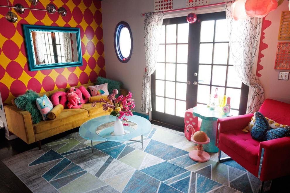 Flamingo Room with mustard velvet sofa and harlequin wall