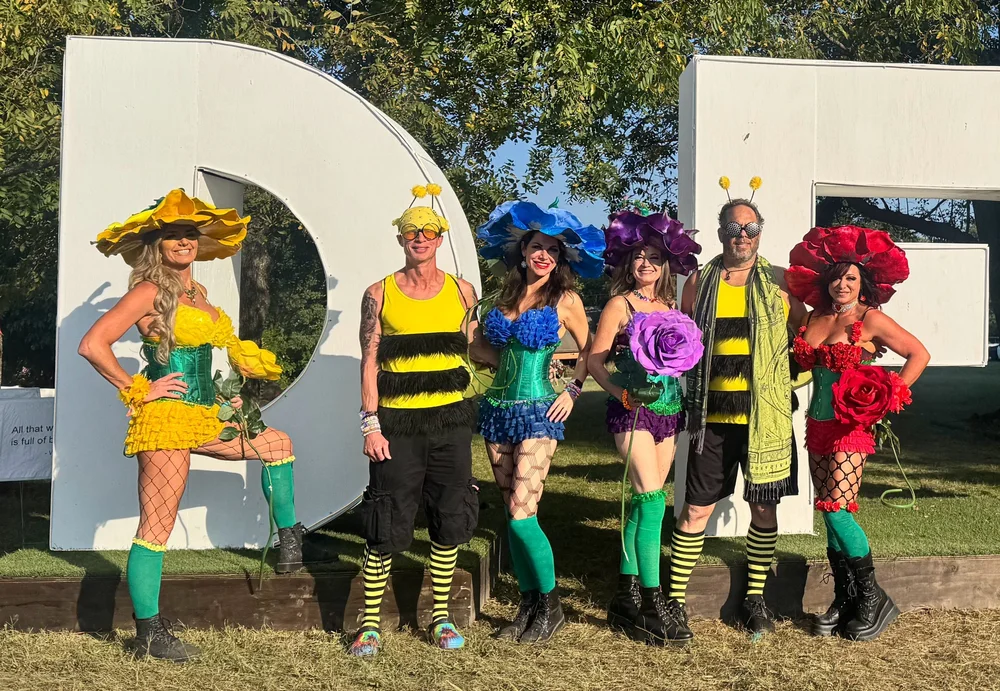 Bee-themed squad at the DFT festival sign