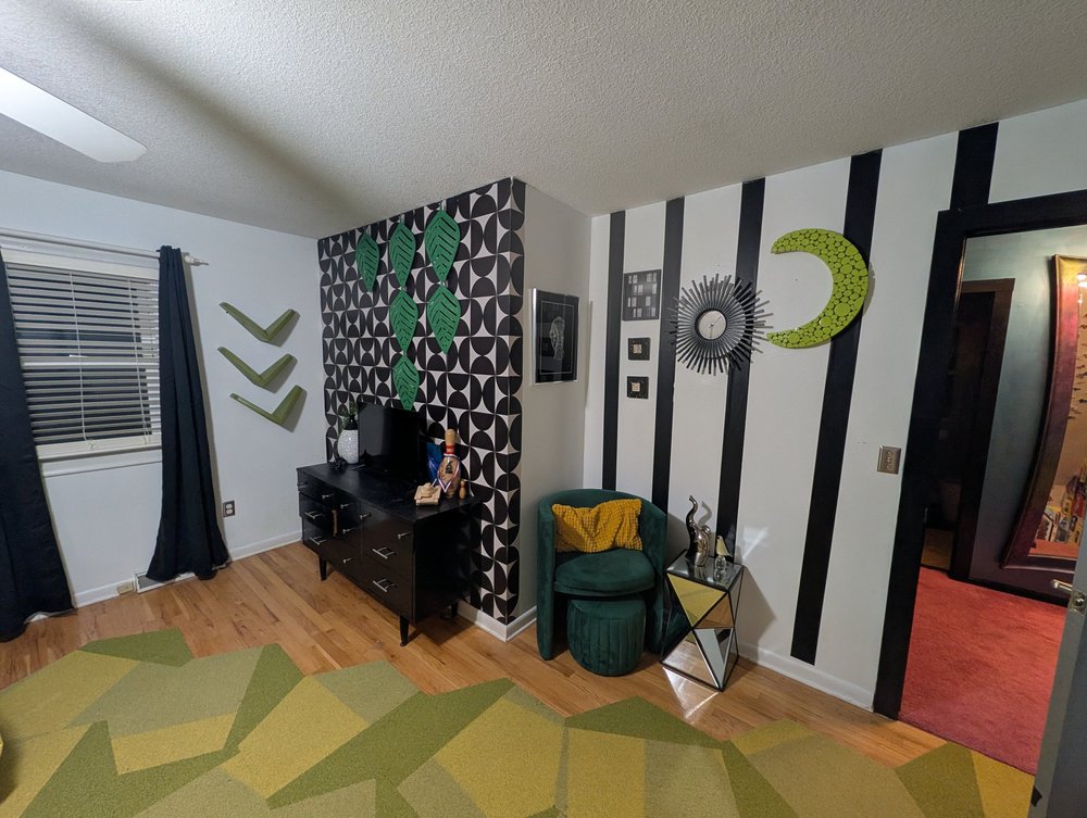 Venom Vault room in black, white and venom green