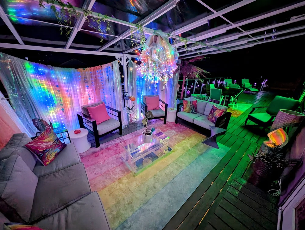 Cotton Candy Cabana deck glowing at night under color-changing lights