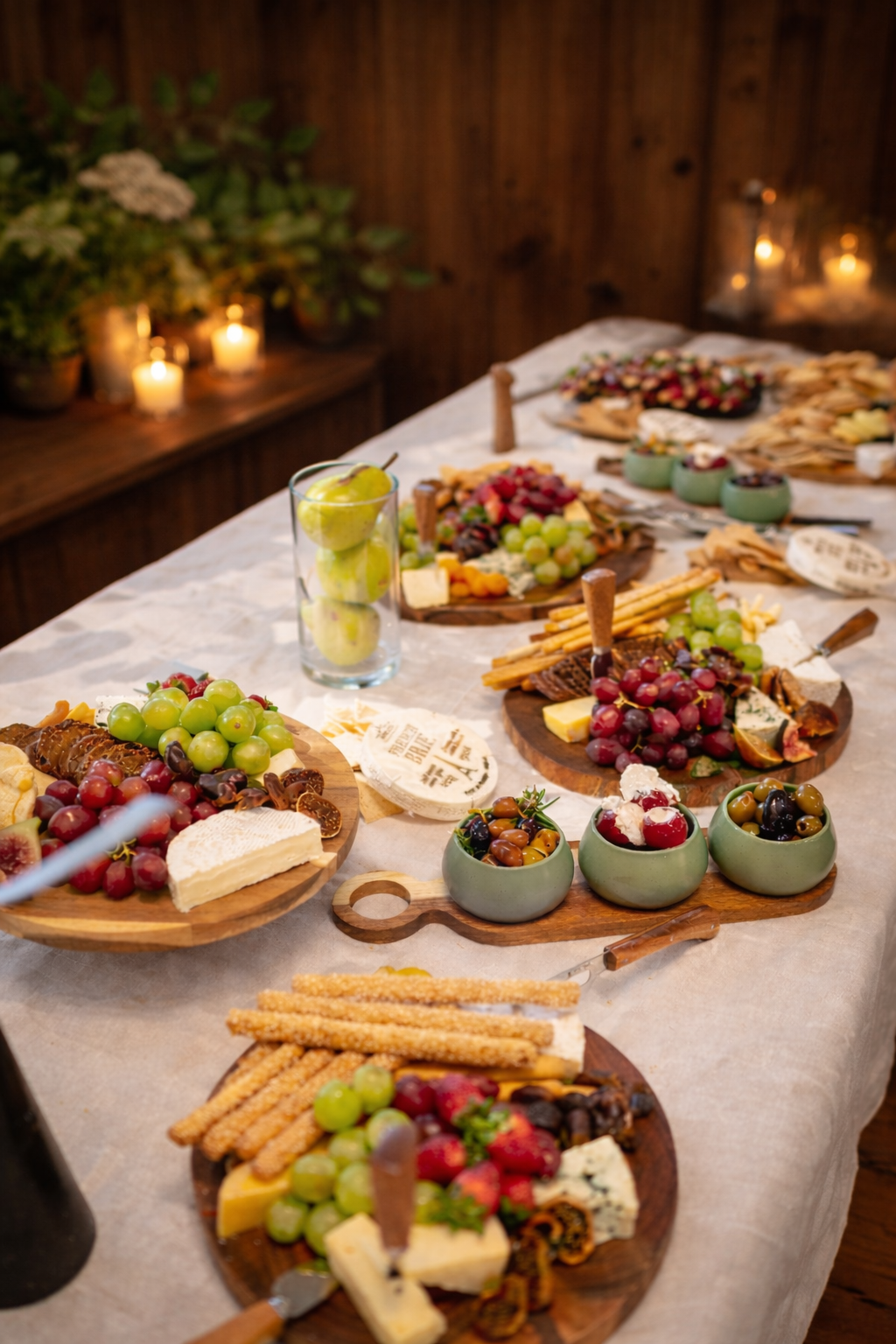 Assorted cheese, grapes, and crackers on wooden boards Mana Kai Catering by McGregor, Private chef Sydney, celebrations, cooking, cheffing.