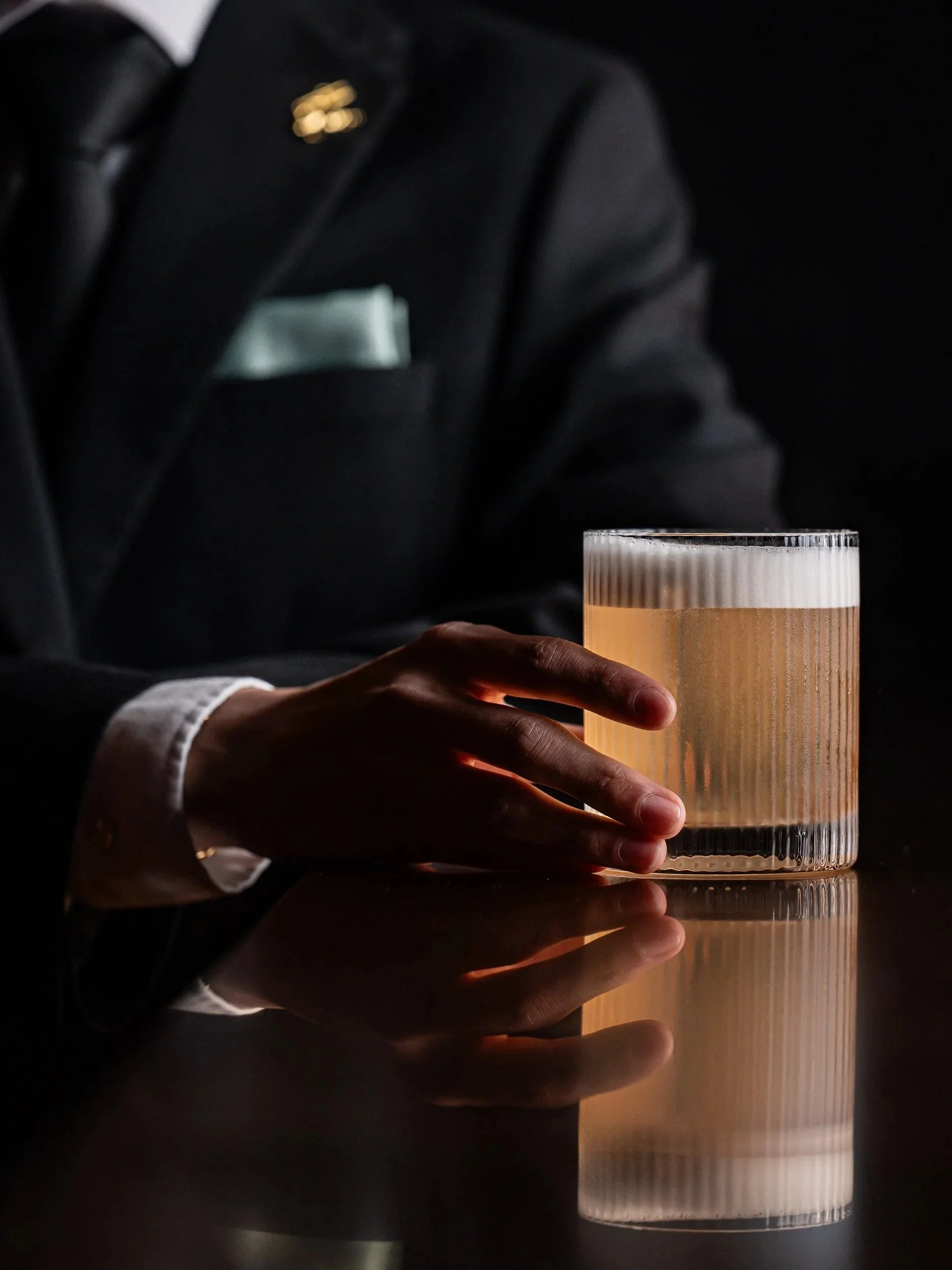 A person drinking a Pear Sour.