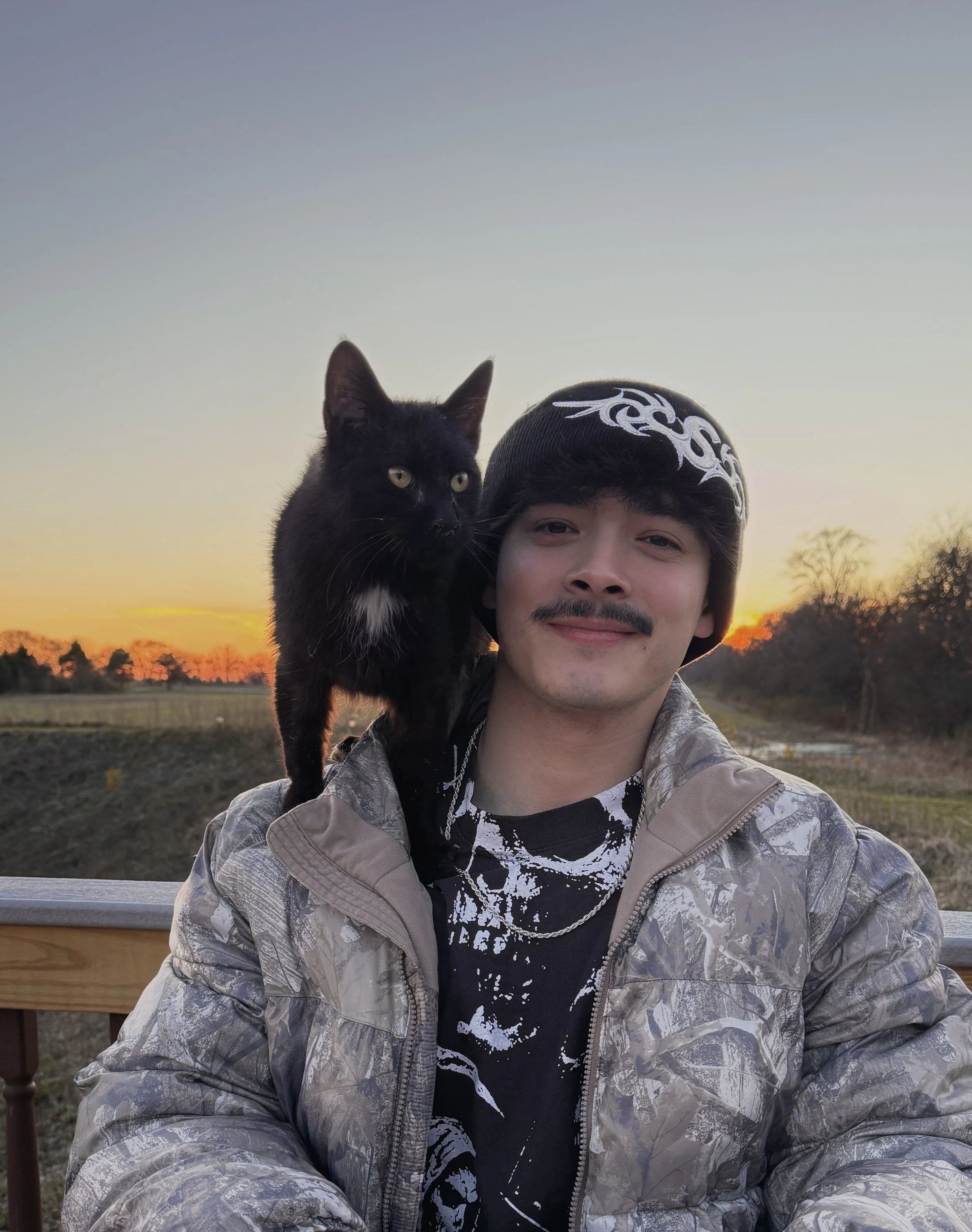 Coach Utah with his pet cat Tonk in a non-athletic environment