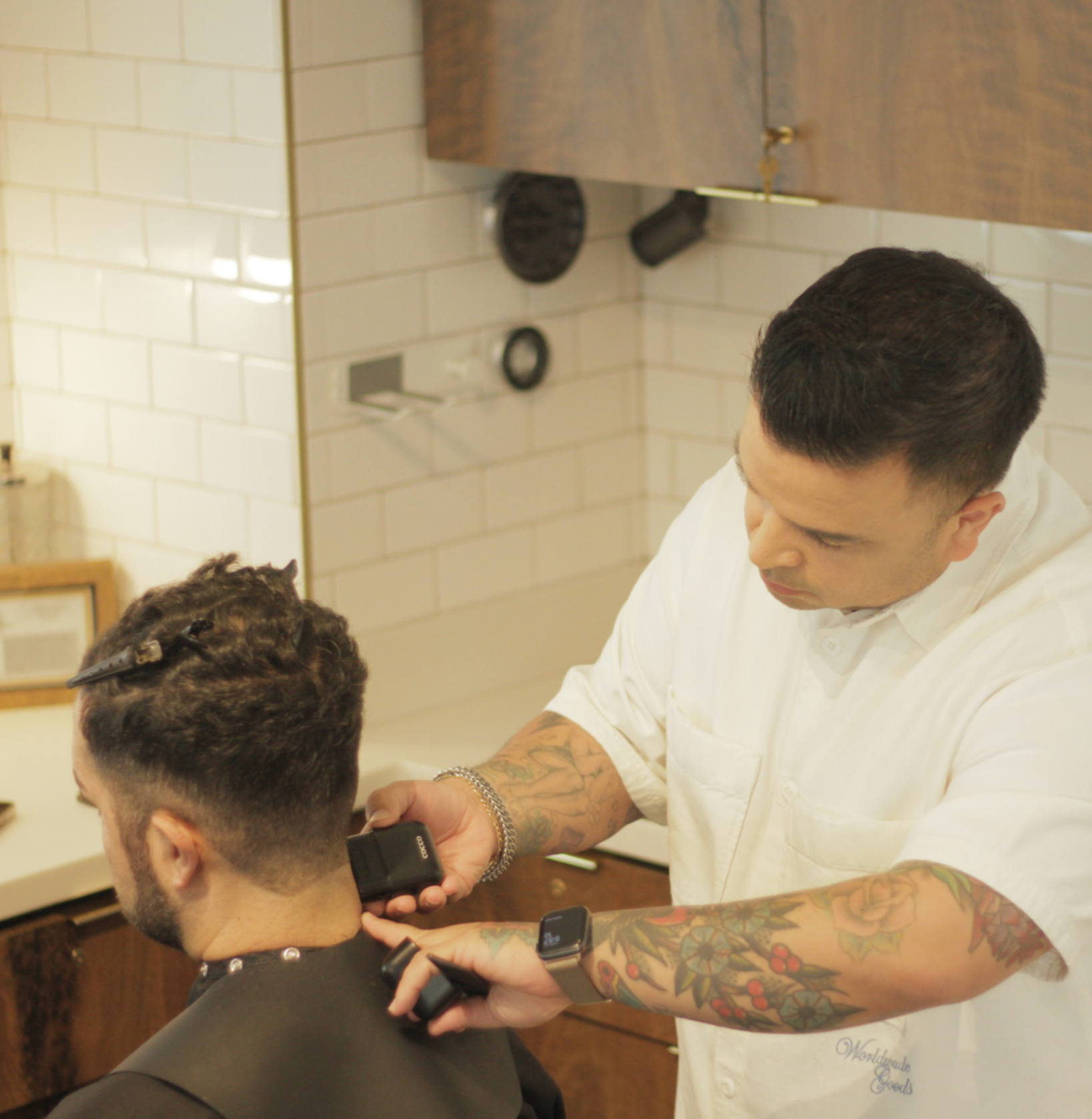 Stylist giving a men’s haircut at Park & Eve Hair Studio in Downtown Los Angeles