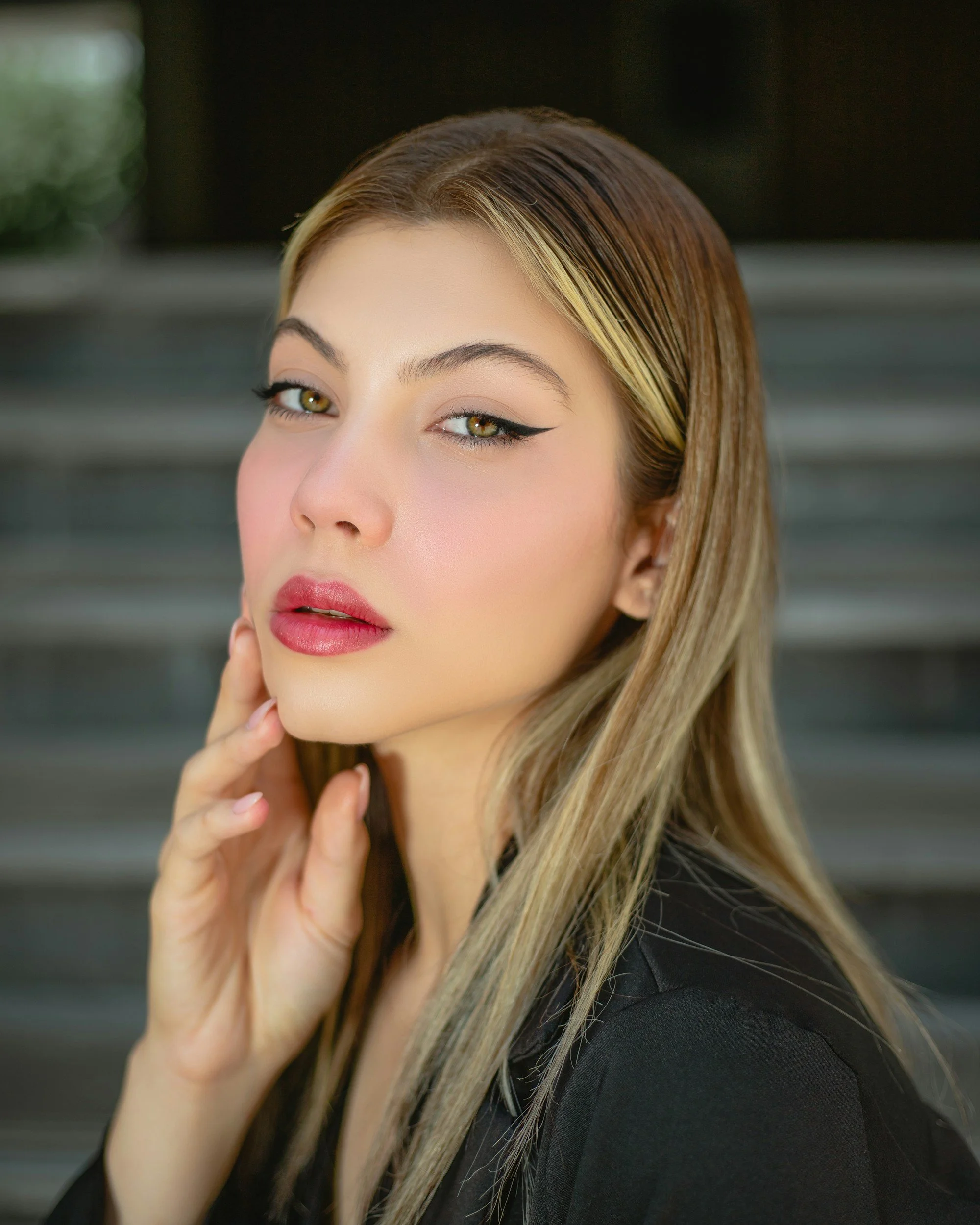 Face-framing highlights creating soft blonde brightness around the hairline