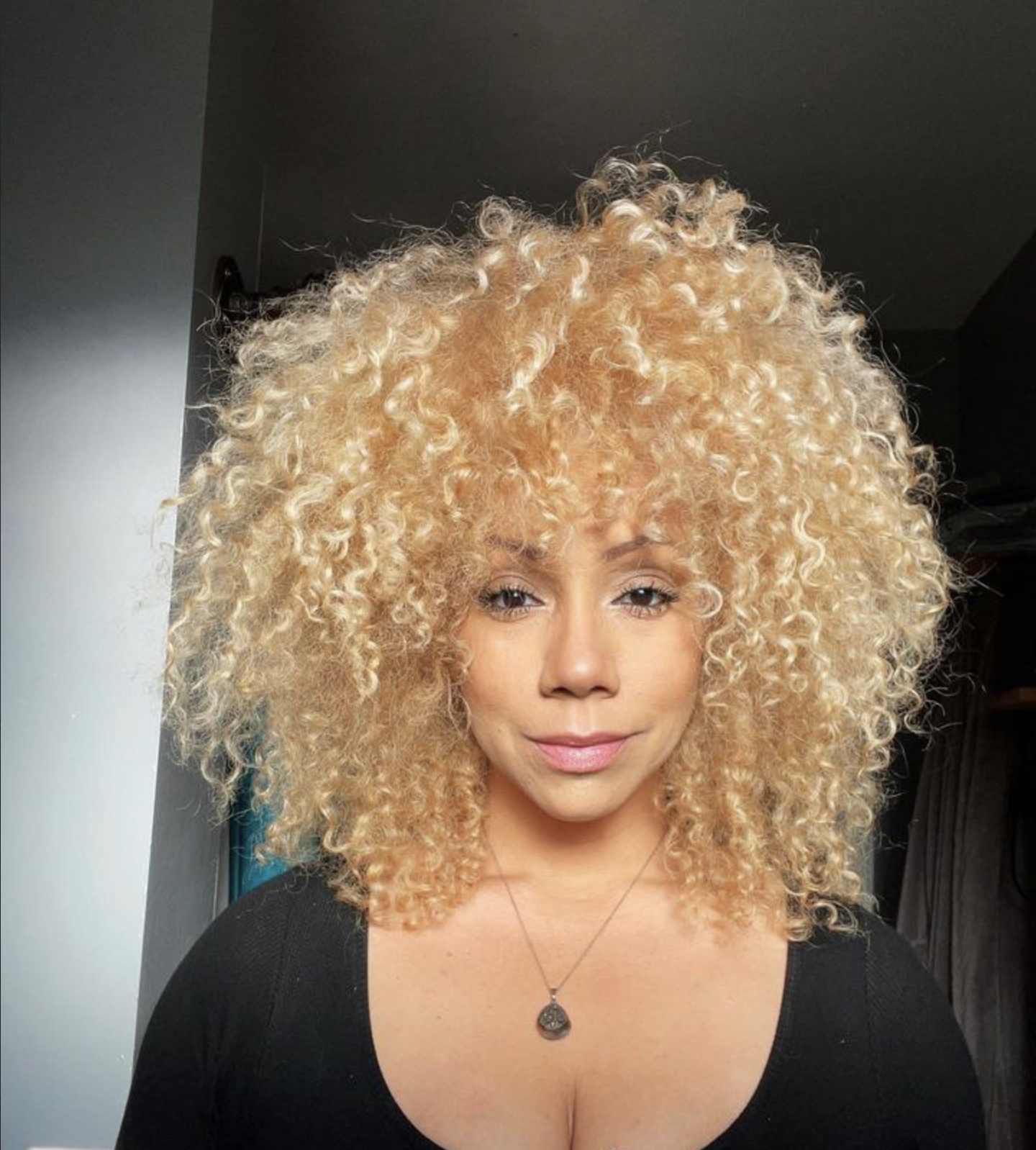 Curl-by-curl haircut on tight curls