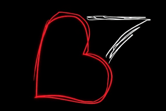 Neon art of a red heart with a white number seven on a black background.