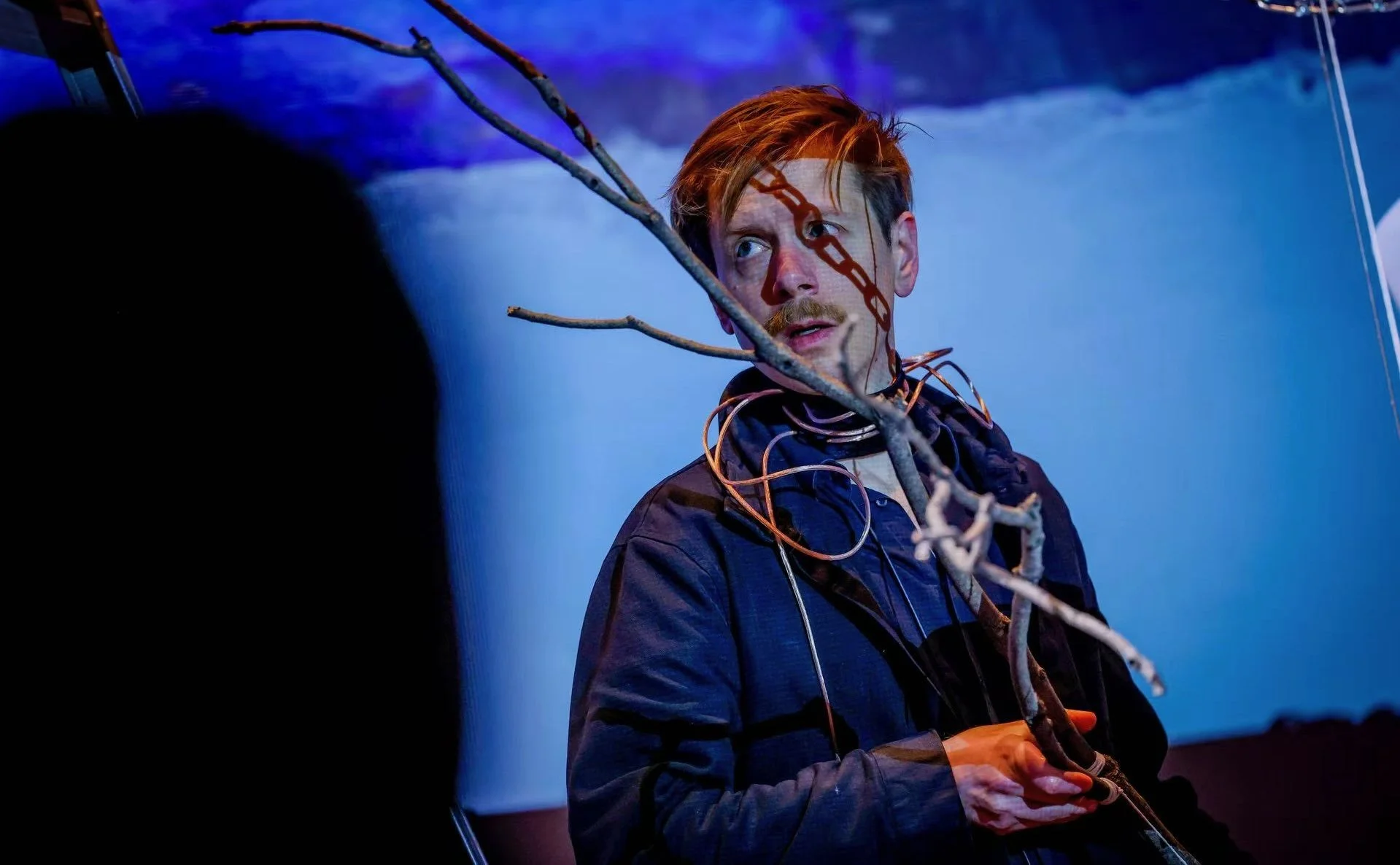 The "tree" is a dry branch attached to a transducer. The sound (of voice, piano, or sonified data) sent to the transducer vibrates the branch, and becomes audible when it touches any of the installation's surfaces.