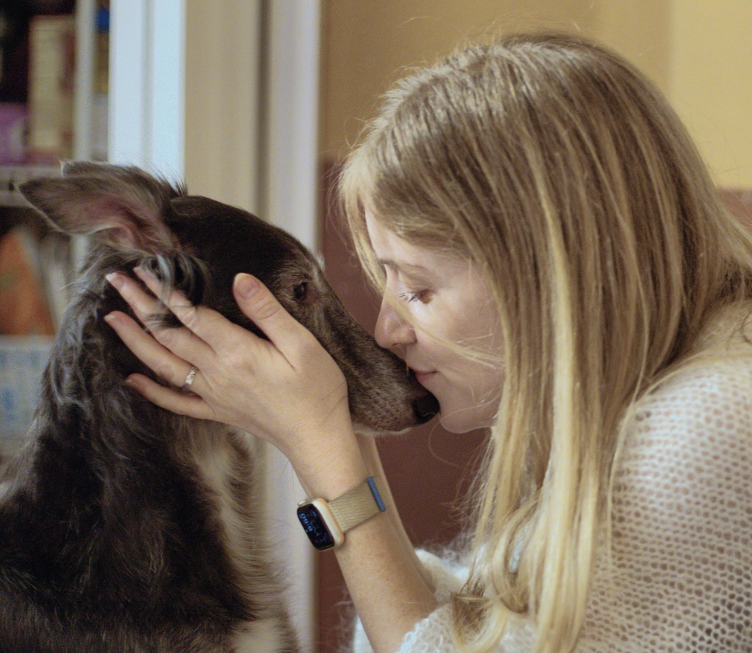 A photo of Corinne Tau with her dog.