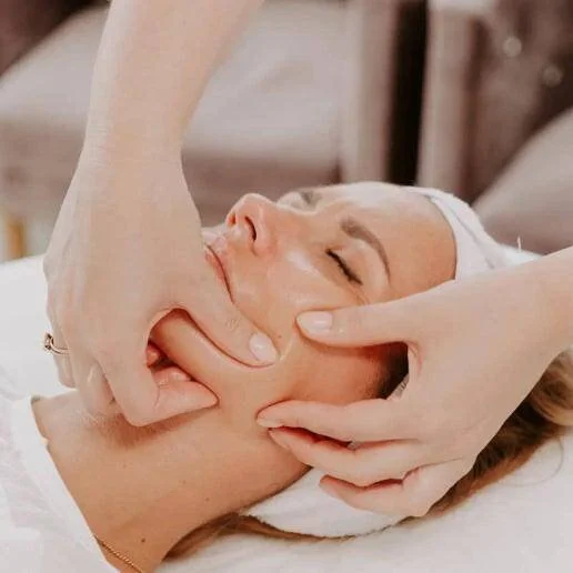 Licensed esthetician performing sculptural facial massage