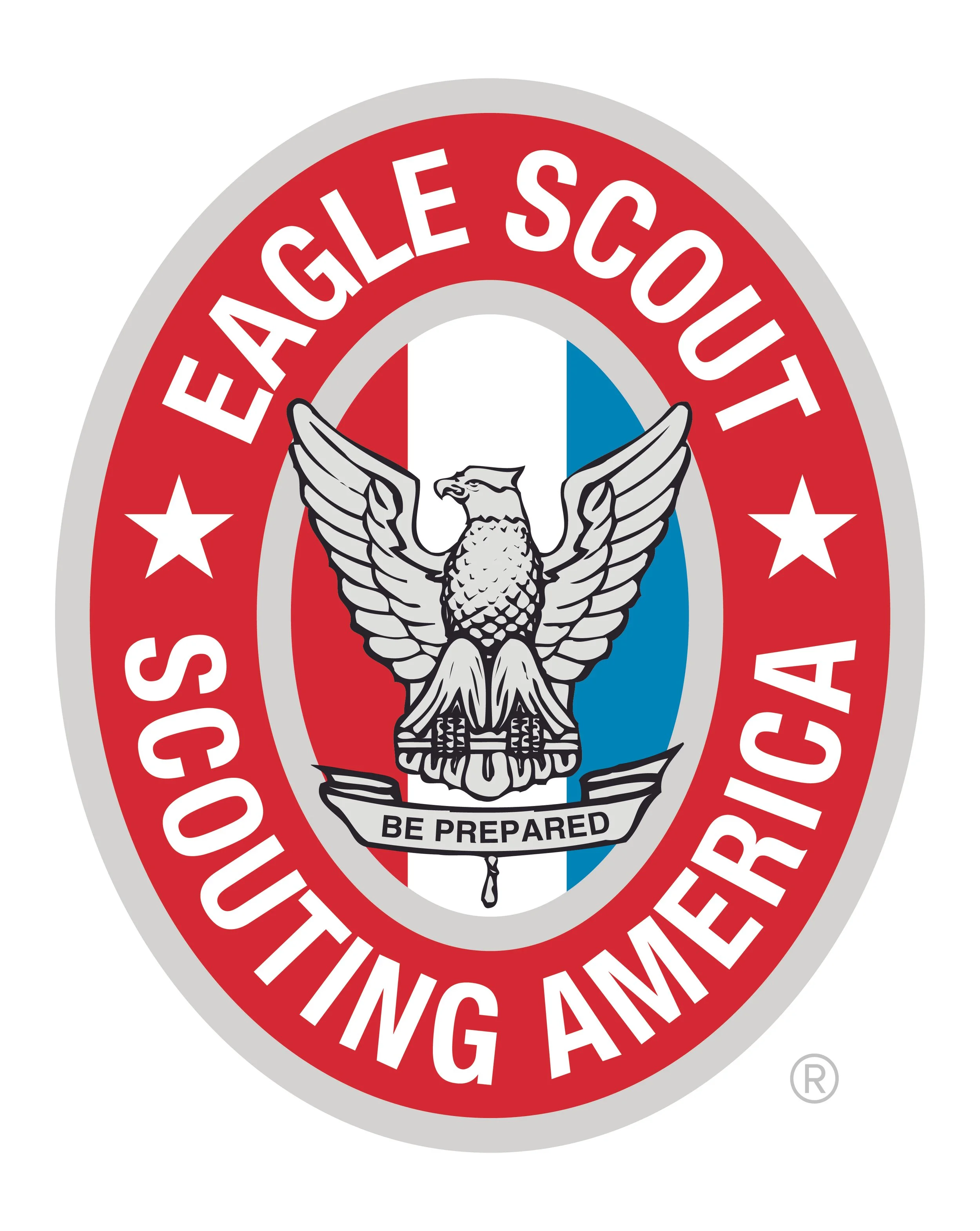 Eagle Scout badge featuring an eagle with outstretched wings, the American flag in the background, and the motto 'Be Prepared' on a ribbon.