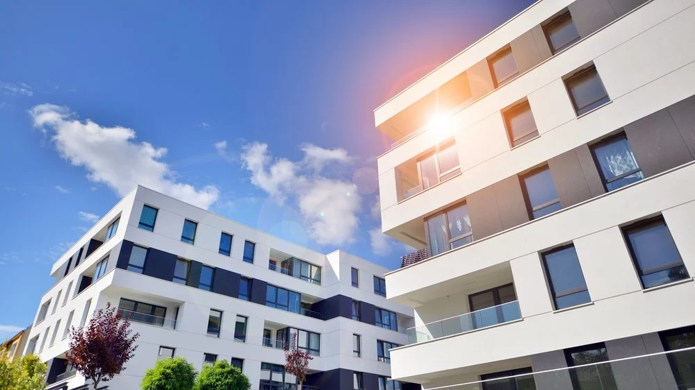 Modern micro-living apartment buildings with compact balconies designed for efficient urban living