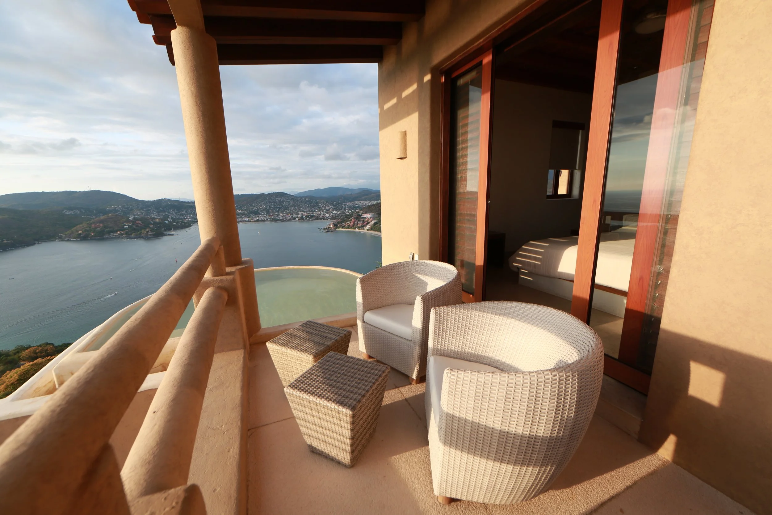 Terrace of an elevated coastal residence overlooking the bay and Pacific Ocean in Zihuatanejo.
