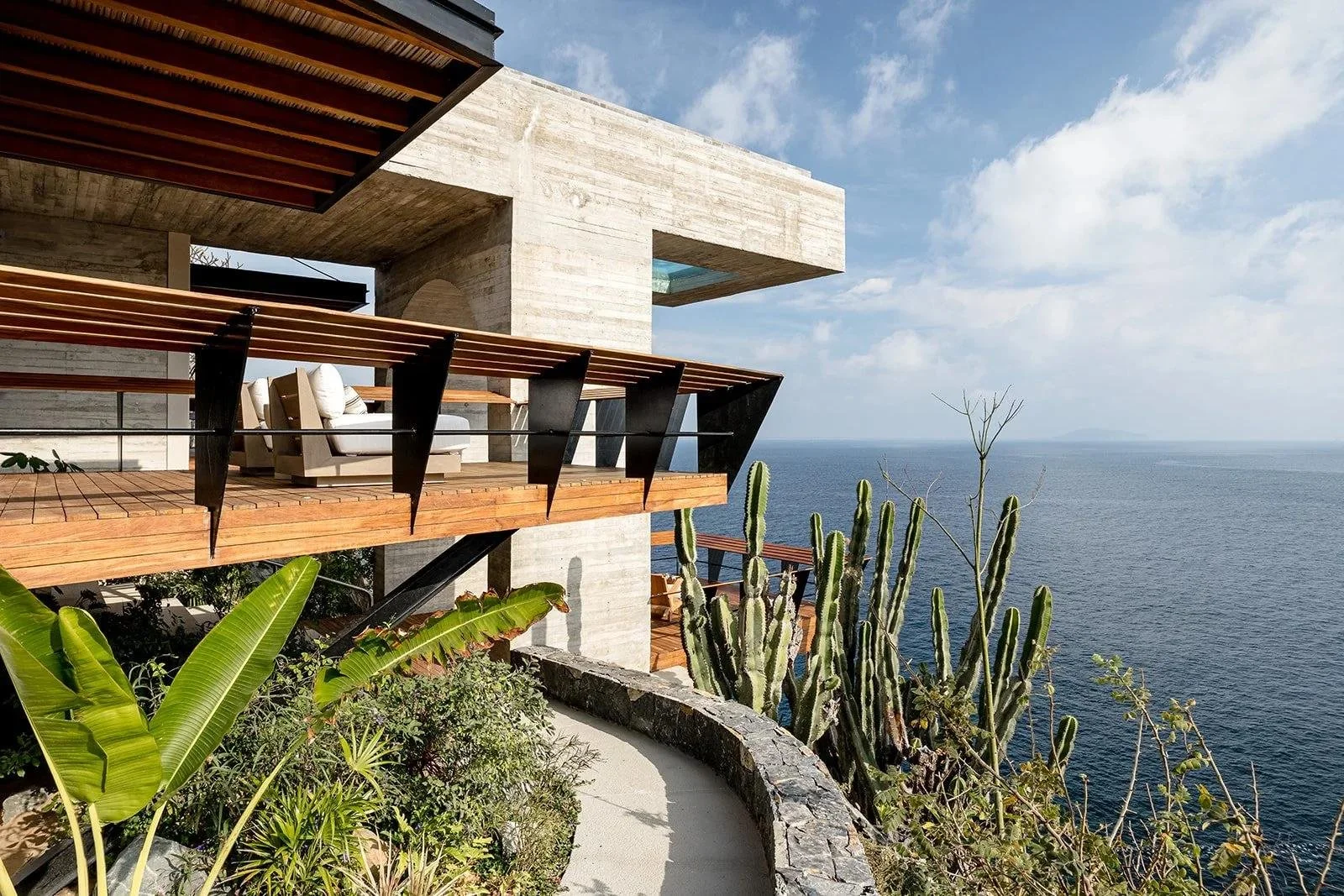 Modern hillside architecture overlooking the Pacific.