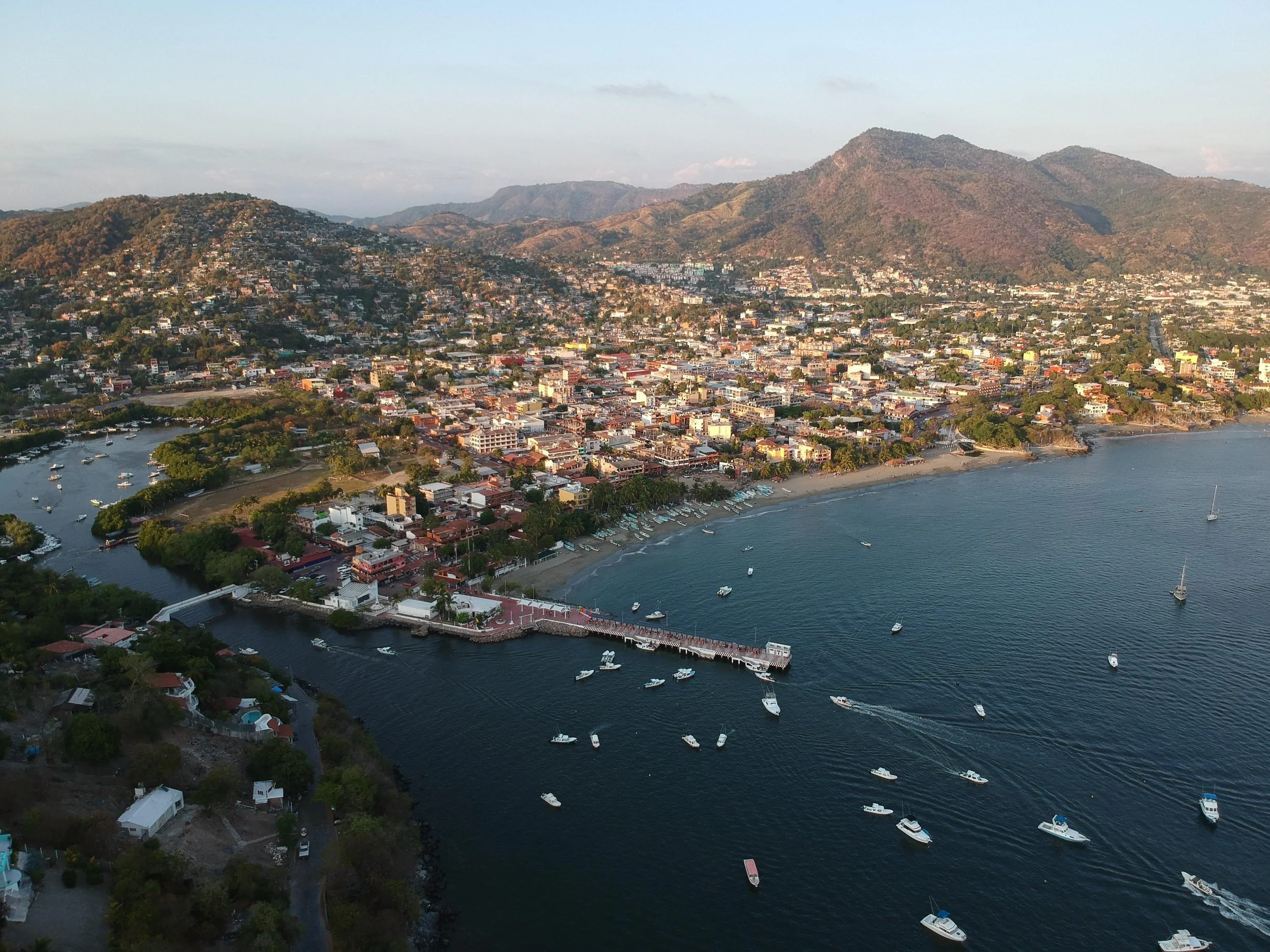 Panoramic view of Zihuatanejo Bay near residences featured within Mar de Palma's Private Collection.