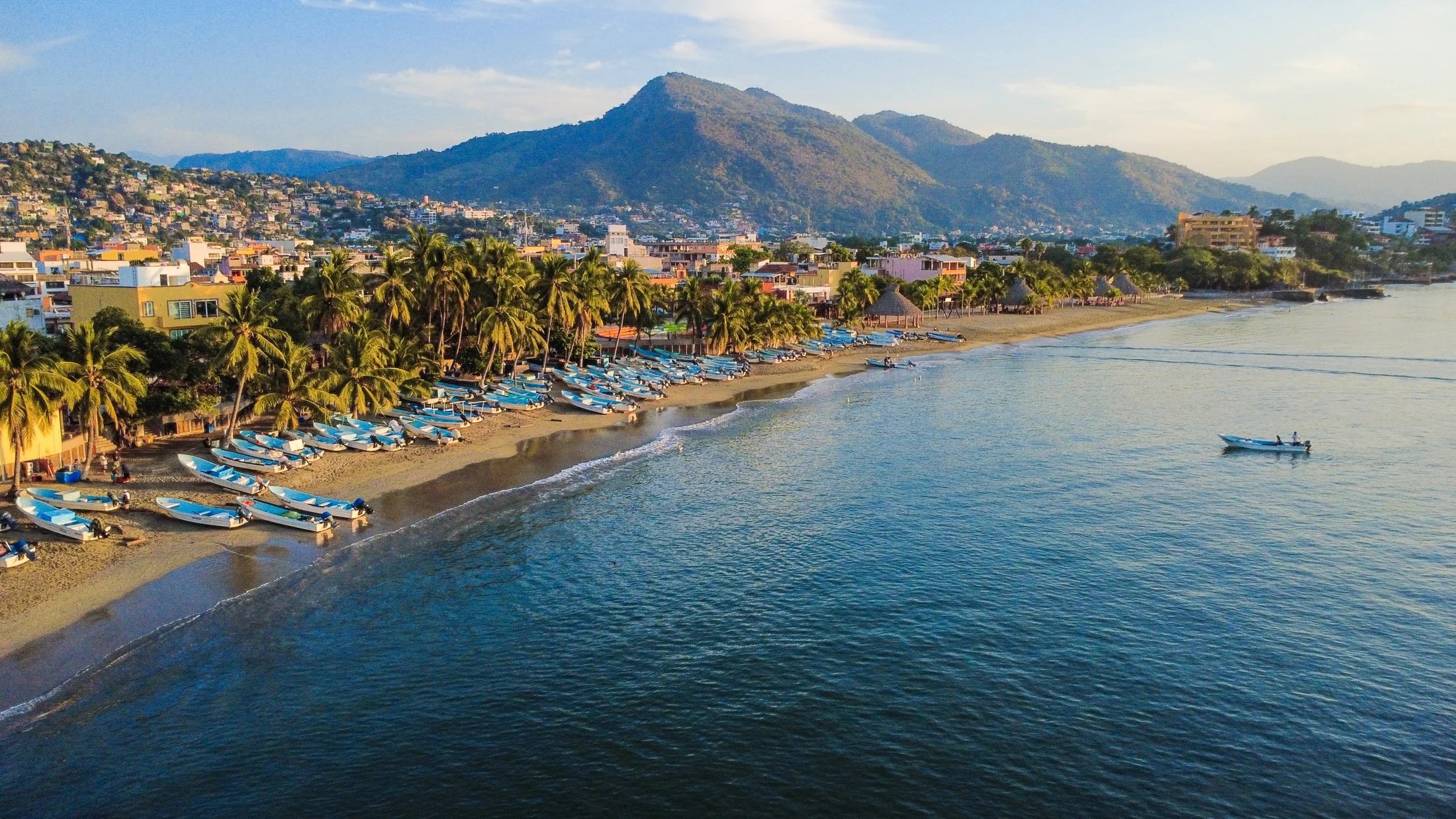 Coastal view of Zihuatanejo highlighting town, bay, and surrounding hills