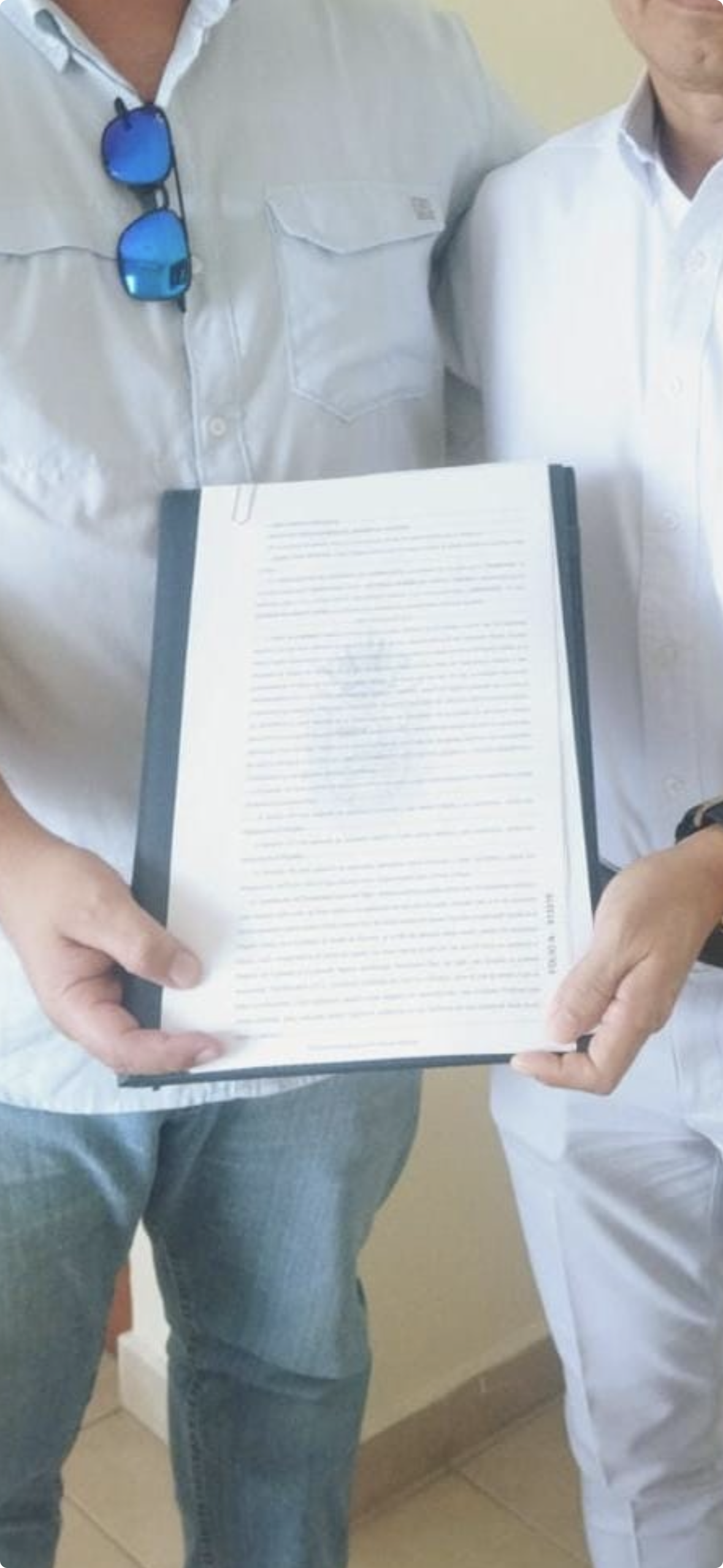 Organized property documents being prepared as part of a real estate closing process in Mexico.