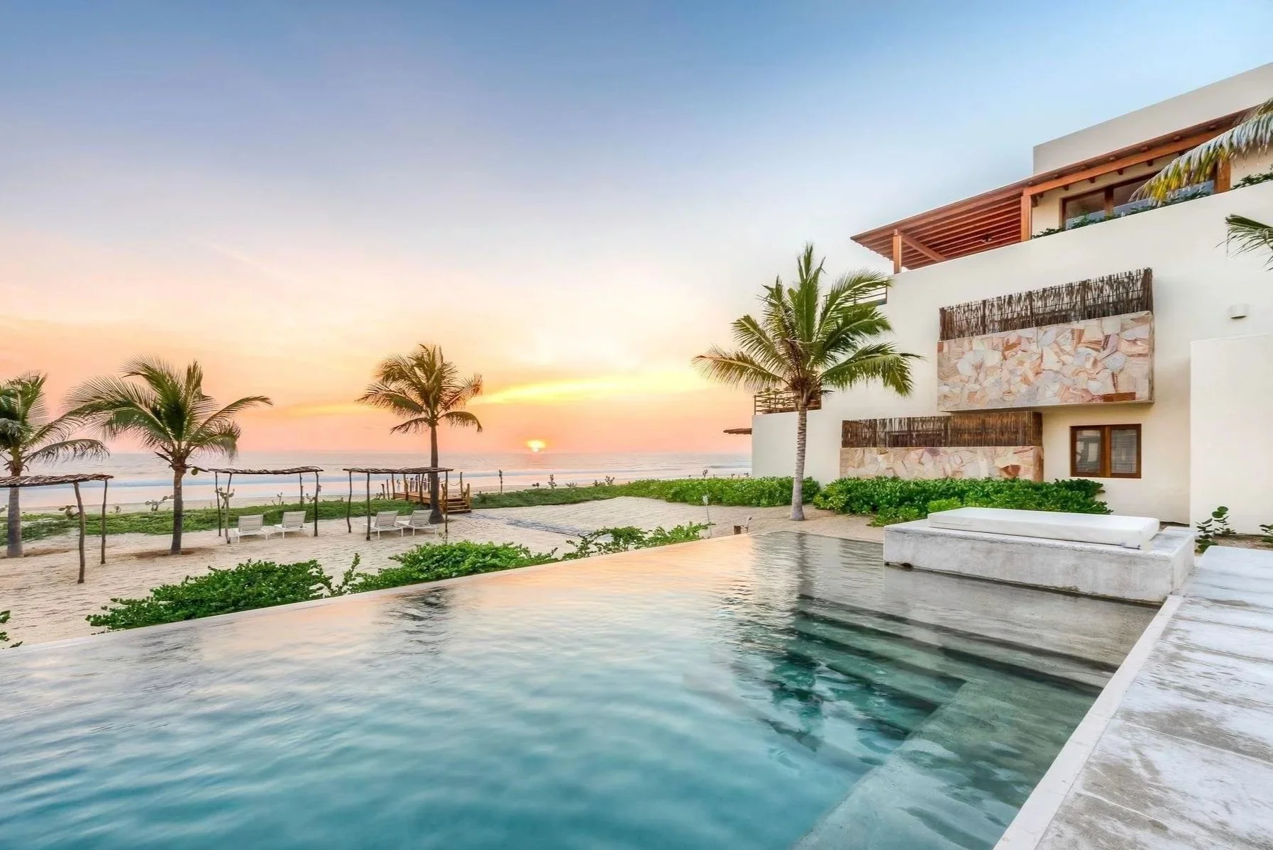 Completed coastal residence with swimming pool and open living spaces near Zihuatanejo, Mexico.