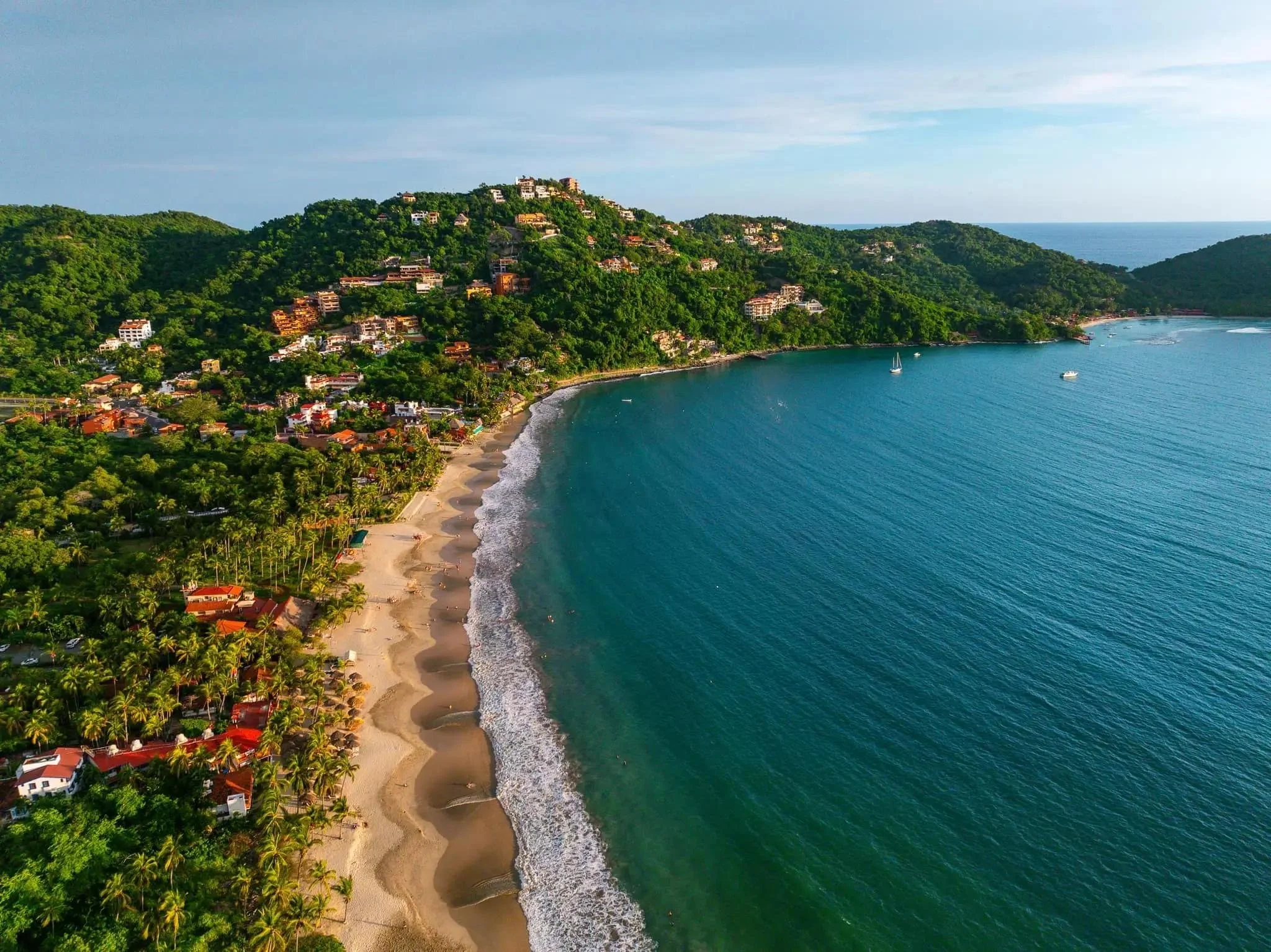 Aerial view of Zihuatanejo and its residential areas explored through Mar de Palma's Independent Property Search.