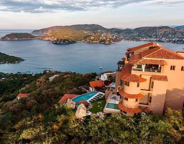 View across Zihuatanejo Bay representing the coastal lifestyle available to international property buyers.